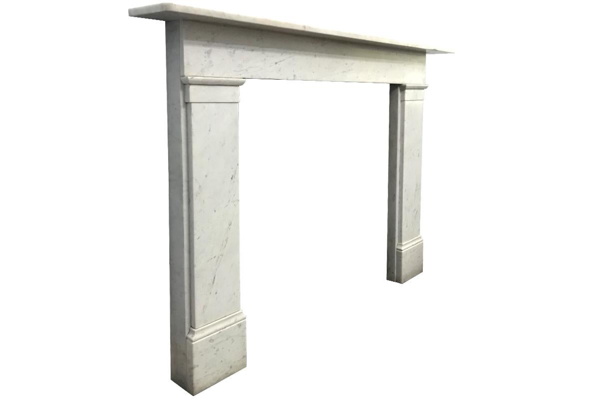 Simple reclaimed Victorian Carrara marble fireplace surround with a full width frieze, circa 1880. 

The simple lines and construction of this fire surrounds means it will sit comfortably in both traditional and contemporary interiors.
