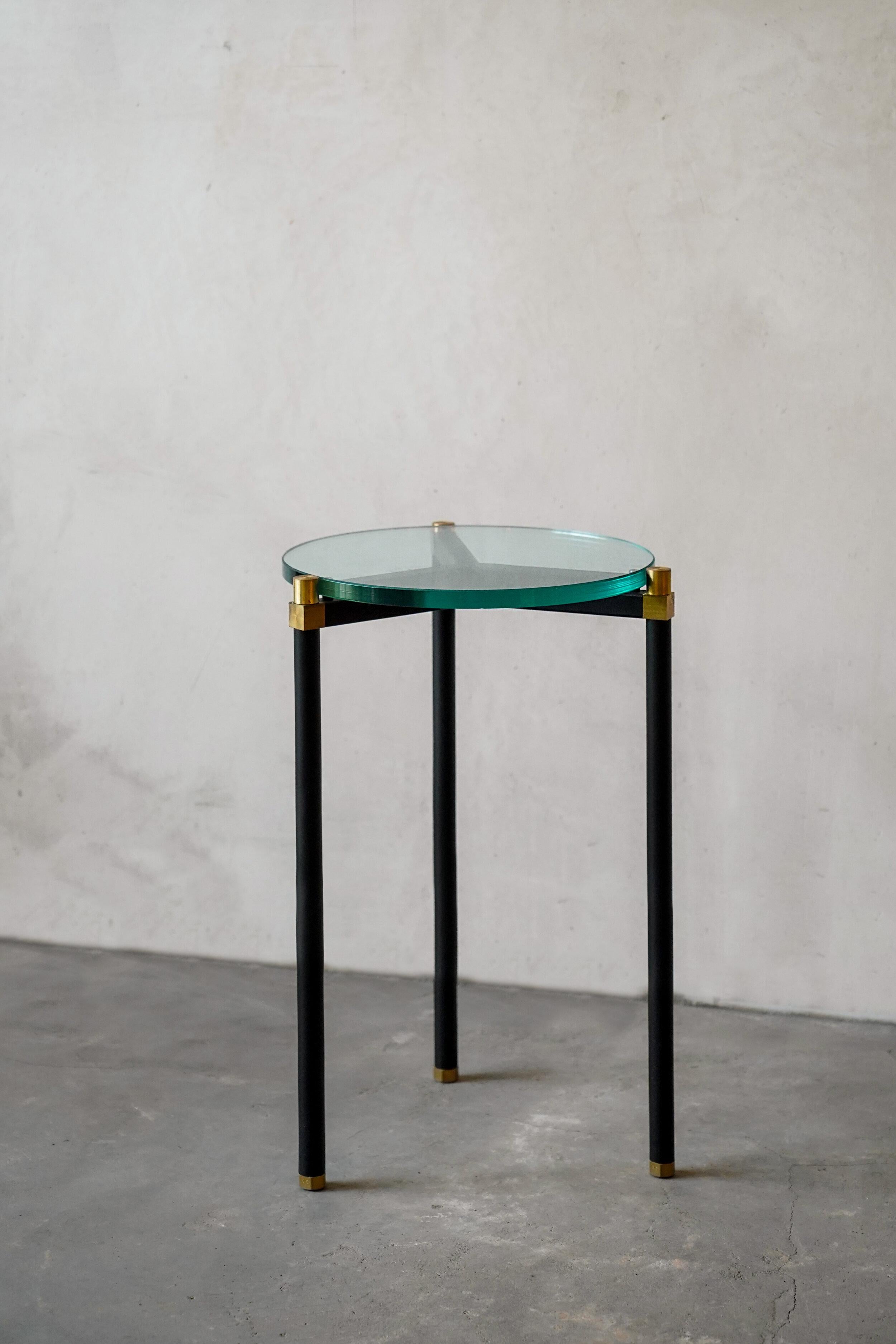 Simple side table 30 3 Legs by Contain
Dimensions: D30 x H51 cm 
Materials: iron, brass, terrazzo, marble, stone.
Available in different finishes and dimensions. 

The Connector furniture collection is based on single assembly pieces that get