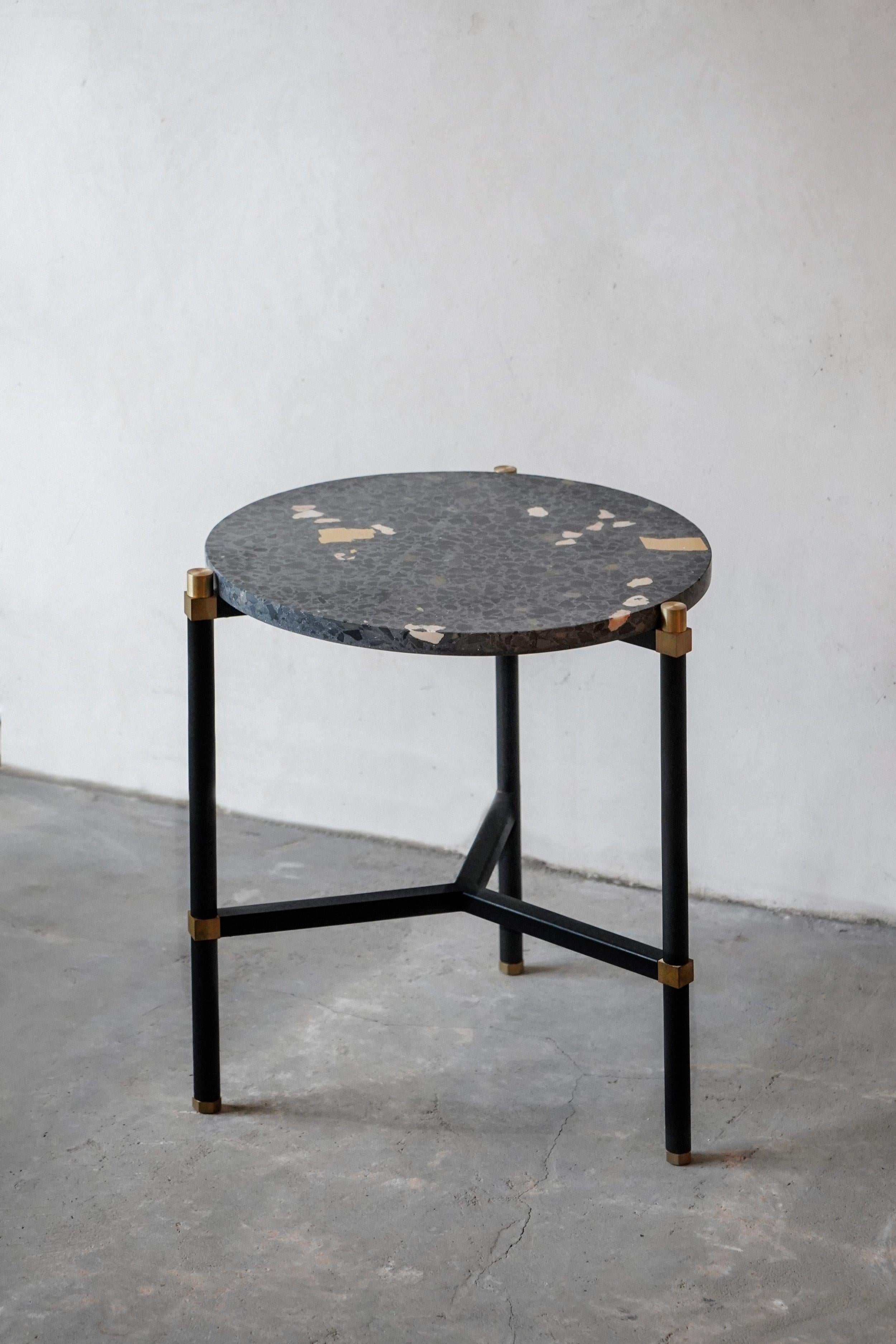 Simple side table 40 3 legs by Contain
Dimensions: D 40 x H 51 cm 
Materials:iron, brass, terrazzo, marble, stone.
Available in different finishes and dimensions. 

The Connector furniture collection is based on single assembly pieces that get