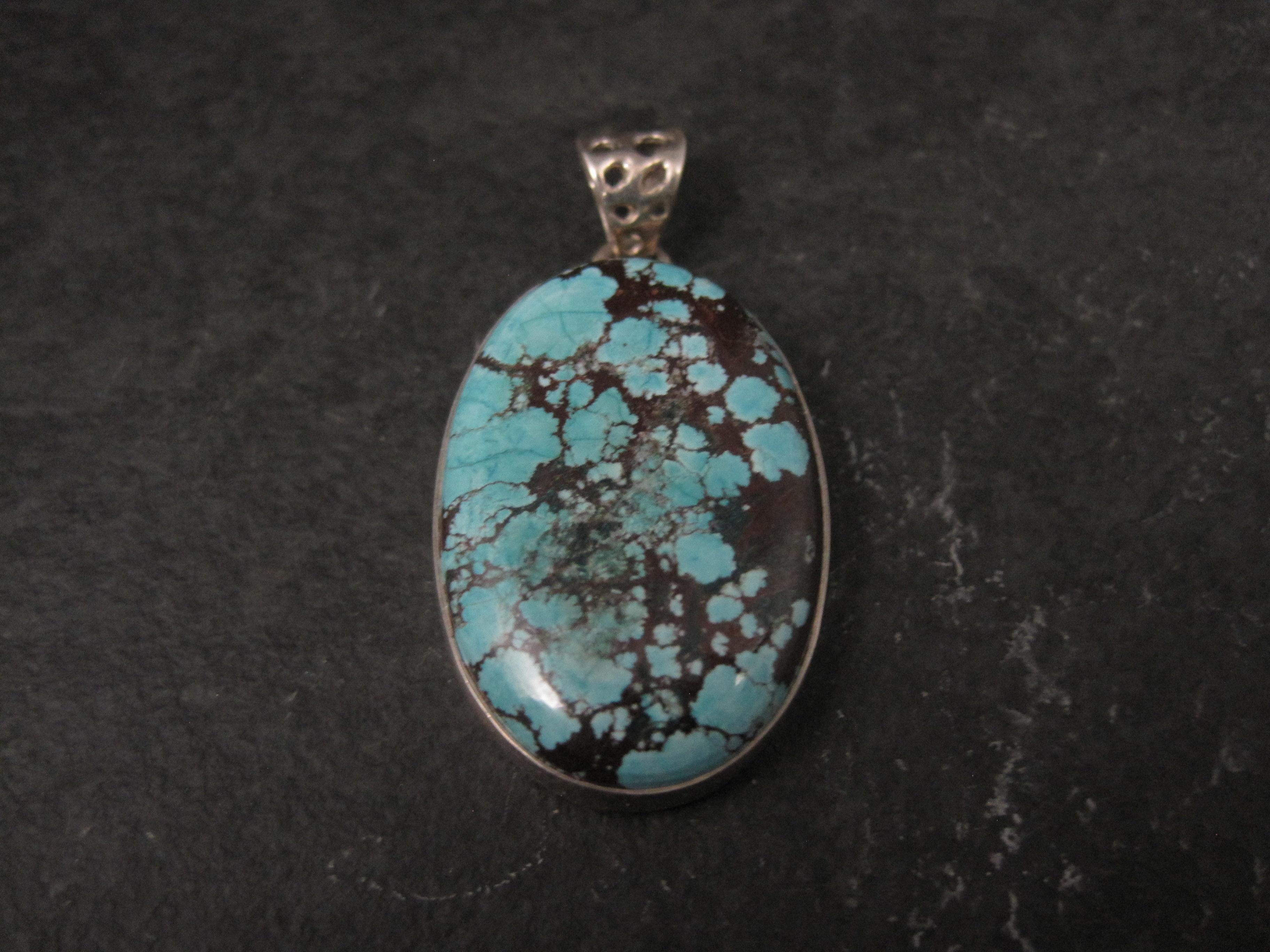 This beautiful, simple pendant is sterling silver with a genuine turquoise gemstone.
The turquoise measures 20x30mm.
The pendant measures 13/16 by 1 5/8 inches, including bail.
Weight: 9.2 grams
Marks: 925
Condition: New - handmade