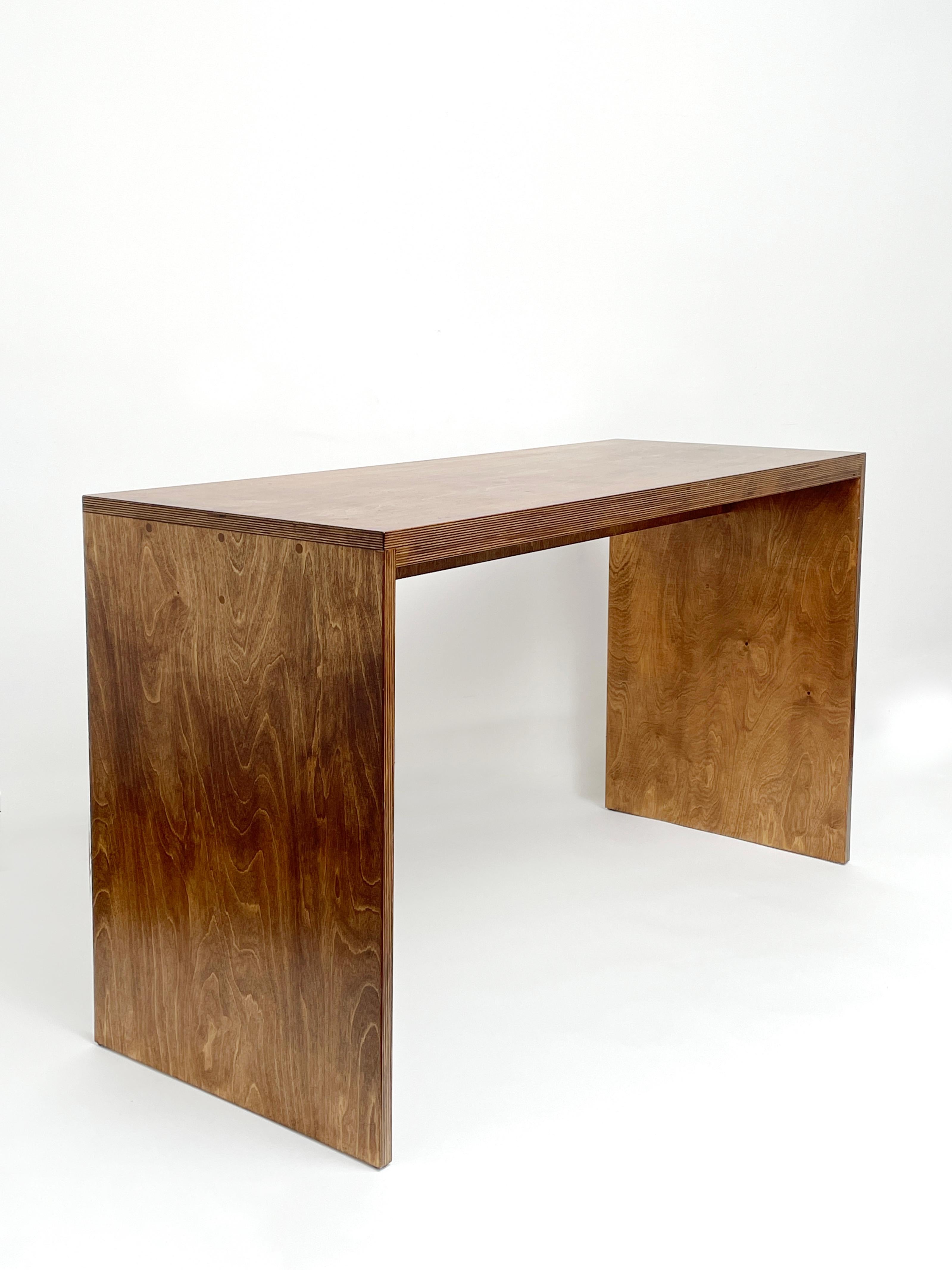 Simple table by Goons
Dimensions:  W 127.2 x D 50 x  H 73 cm.
Materials: Wood.
Dimensions can be adjusted +/- 10 cm.

Goons is located in Paris, France. All of they're designs are made out of wood.