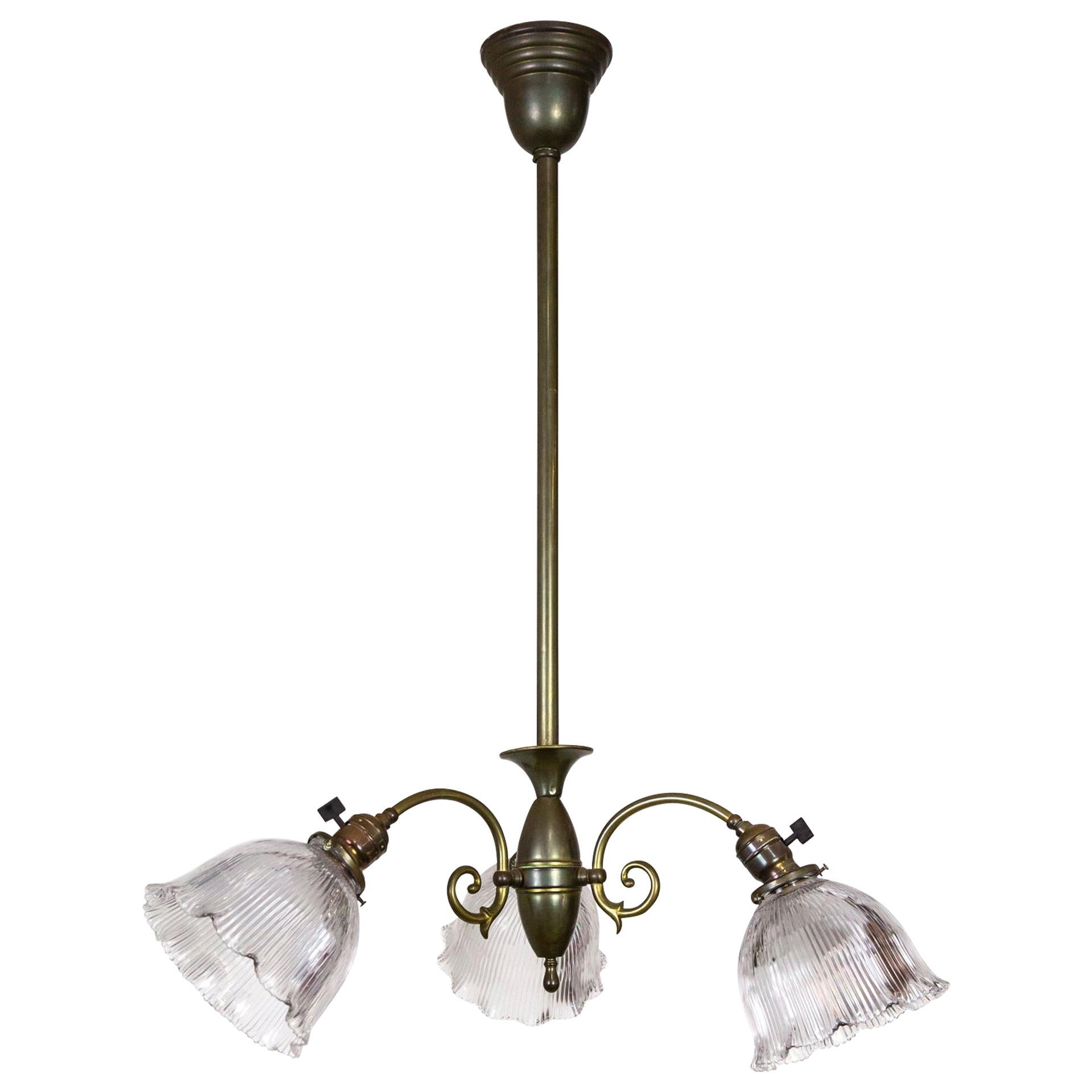 Simple Victorian Brass Chandelier w/ Ruffled Holophane Glass Shades For Sale