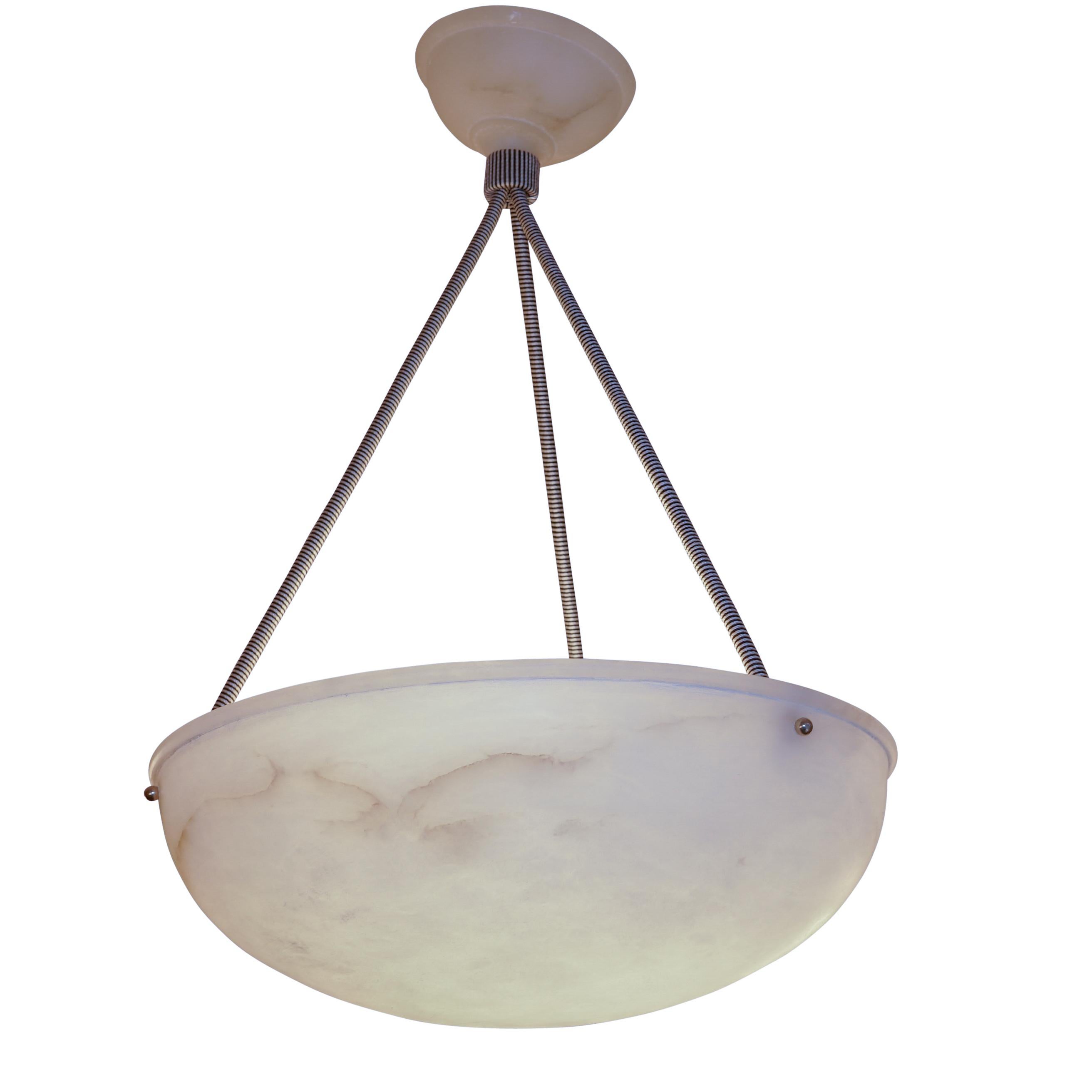 Finely fossilized alabaster with a hint of veining provides soft diffused light.