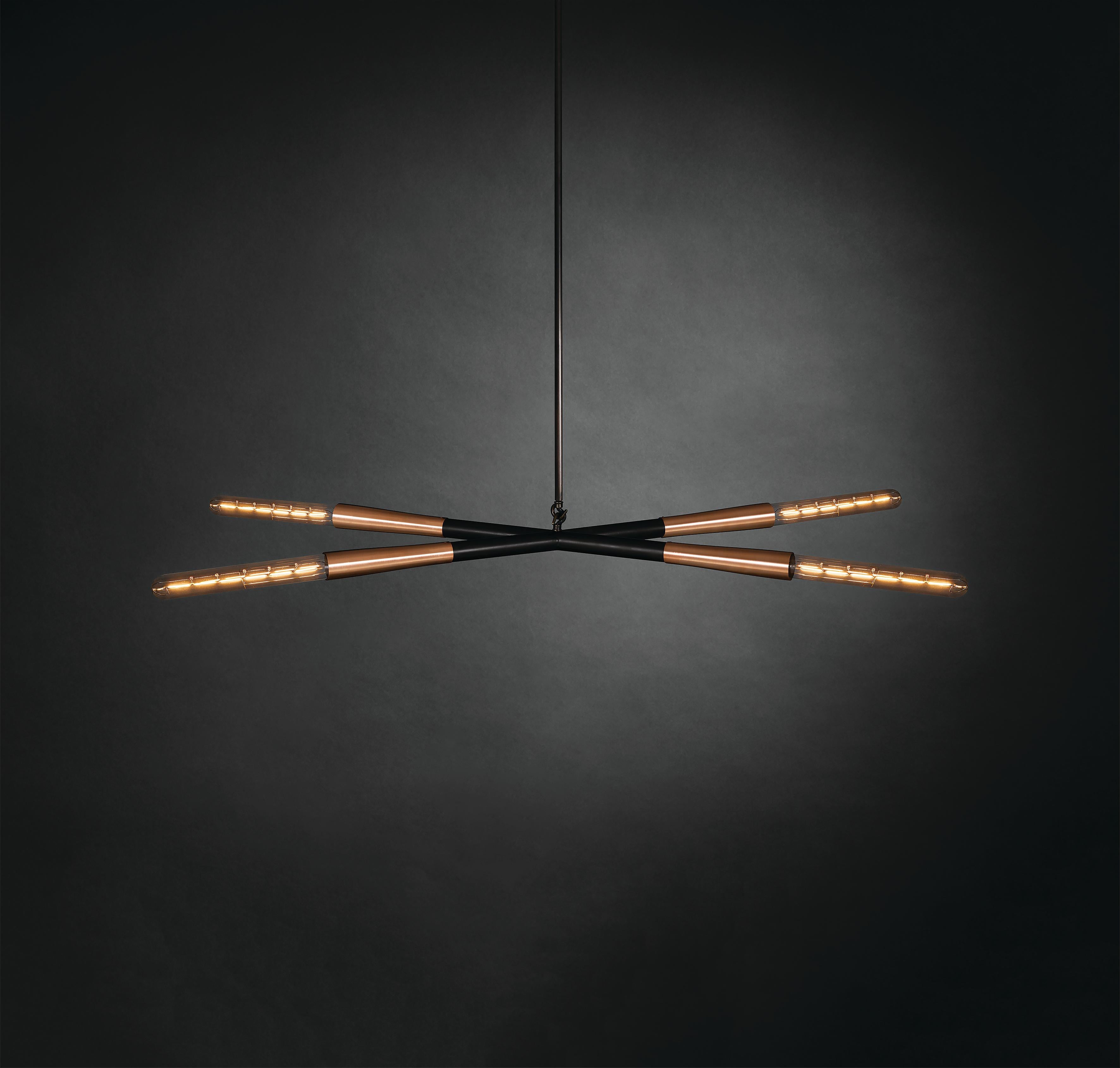 Lampada a sospensione Simple X di Christopher Boots
Dimensioni: D 53 x L 122 x H 4 cm.
Materiali: Bronzo scuro, vetro borosilicato.

SIMPLE SERIES enfatizza la bellezza e la grazia dei gesti più semplici.
Trasformando le icone minimaliste in fari