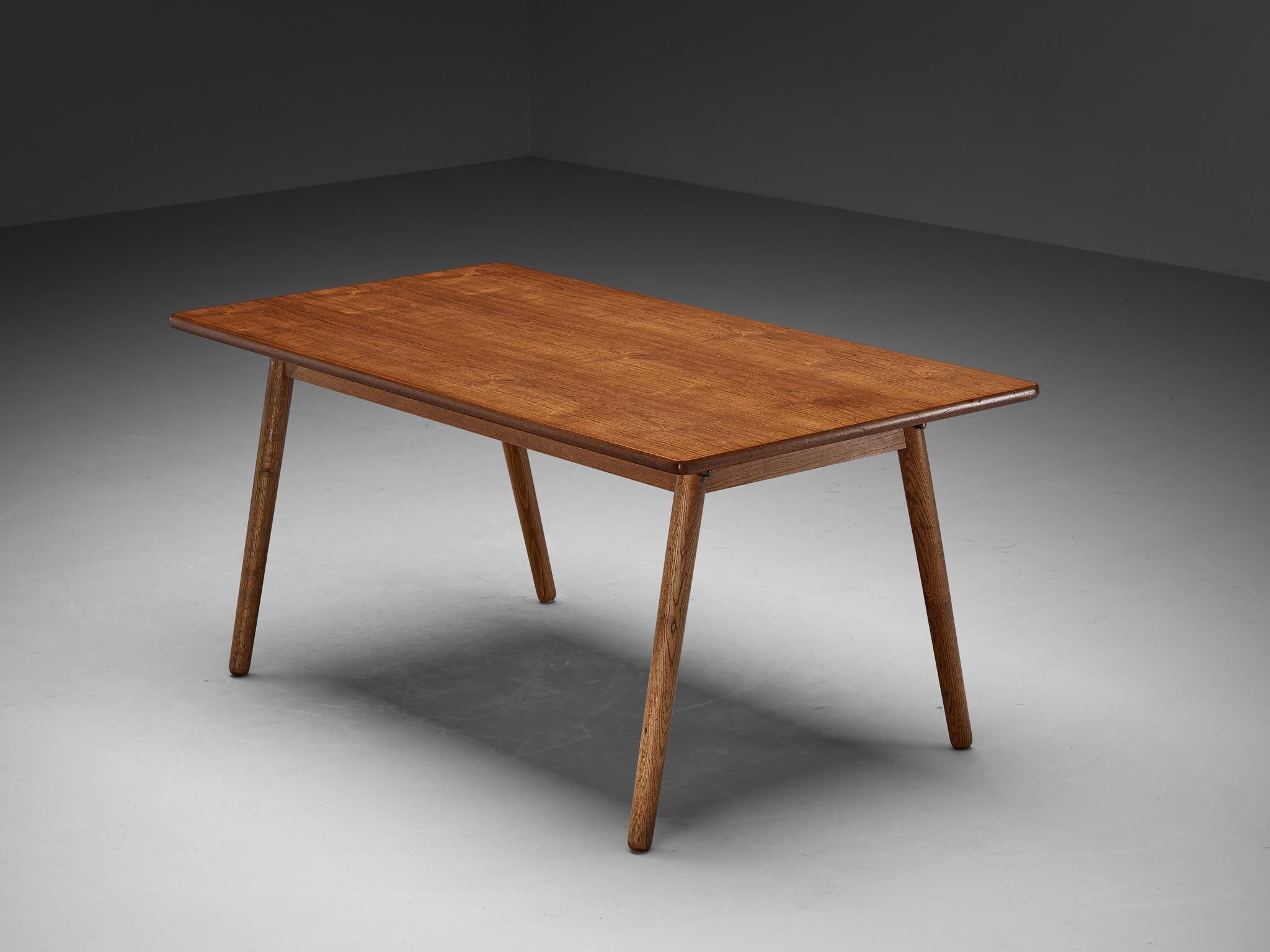 Dining table, teak, oak, pine, Europe, 1960s

Sober and modest table made in Europe in the 1960s. This piece shows beautiful grain in different wood types, a simplistic and functional character. The angled legs create elegance within the design of