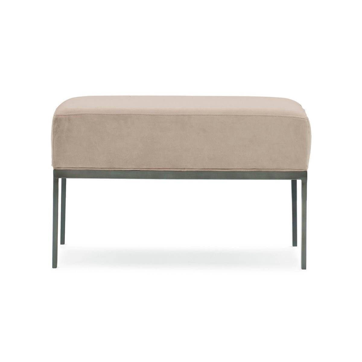 Destined to be remembered, this expressive bed bench is as functional as it is fashion-forward. Its upholstered seat is plush yet supportive and framed in metal with a Zinc Oxide finish. Pencil legs give it a modern vibe while providing solid