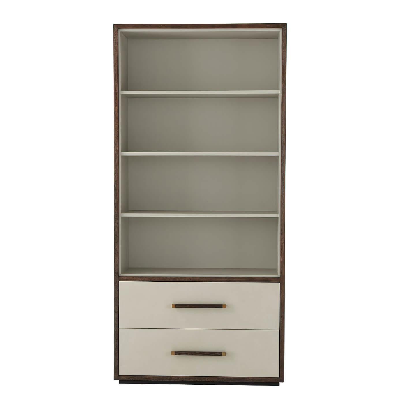 An elegant modern open bookcase with a lacquered interior, leather-wrapped drawers and our Cardamon finish frame and handles, with brushed brass finish accents. Soft closing drawers, anti-tip kit, and adjustable shelves.
Dimensions: 38