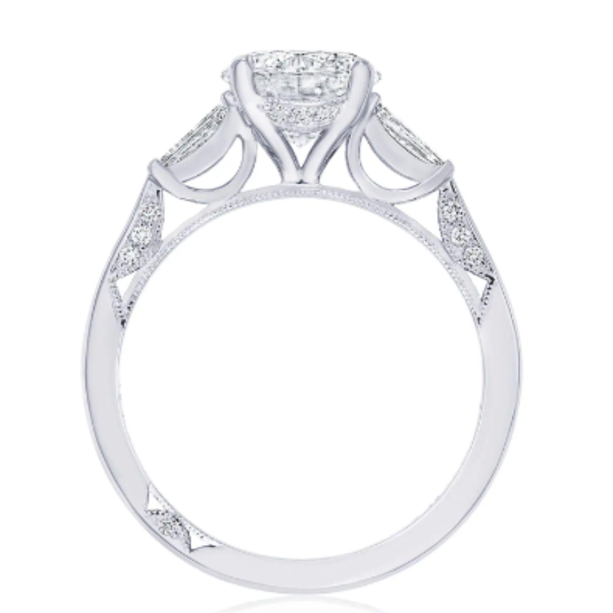 Let your diamond engagement ring stand out by contrasting your side stones with your center diamond! Baguette side stones graduate to the round center mounting, bringing a magical contrast to bring about beauty from every angle. The ring is set with