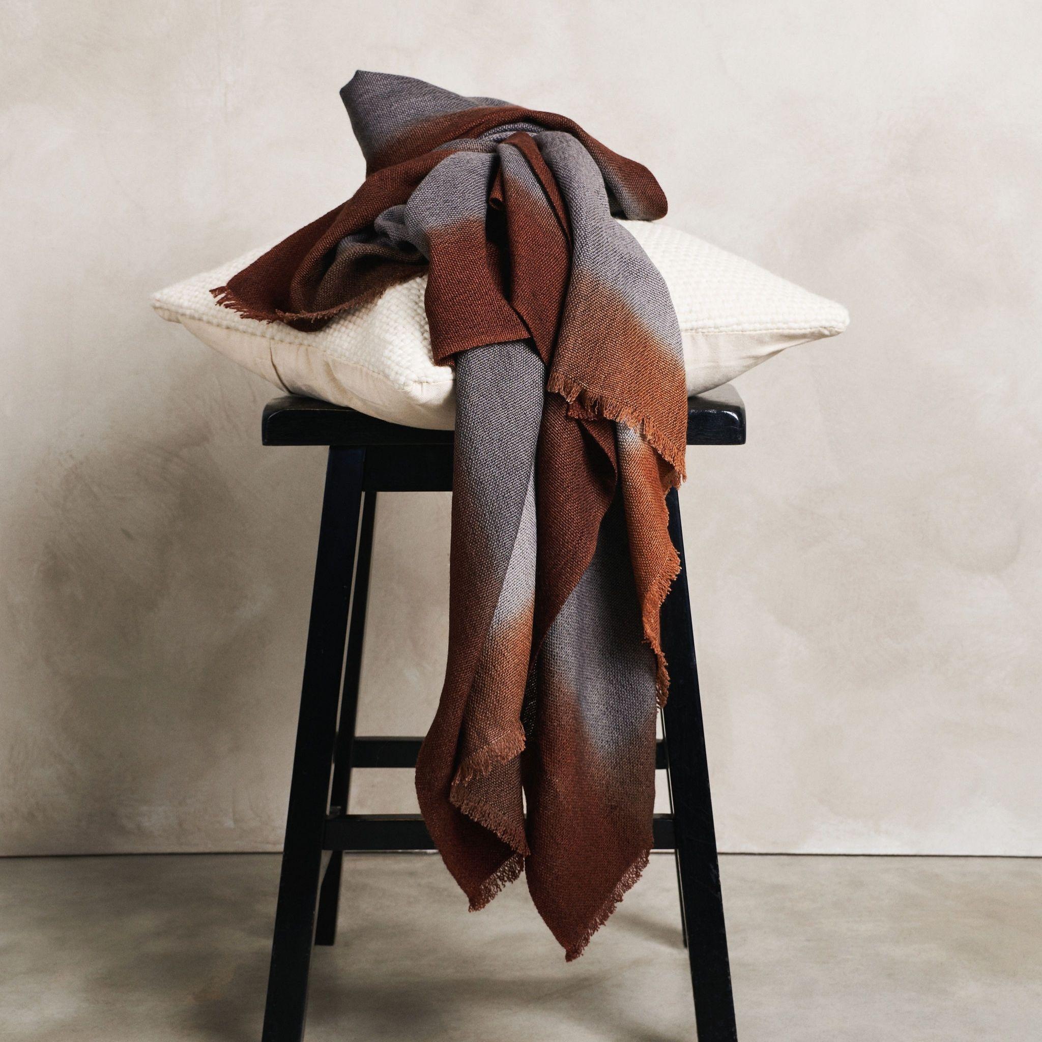 Simply Taupe handloom merino  throw / blanket is handwoven by master weavers in Nepal and dip dyed entirely with certified Eco-friendly Swiss Dyes.

Each piece is individually dip dyed entirely using earth-friendly dyes. The design is comprised of