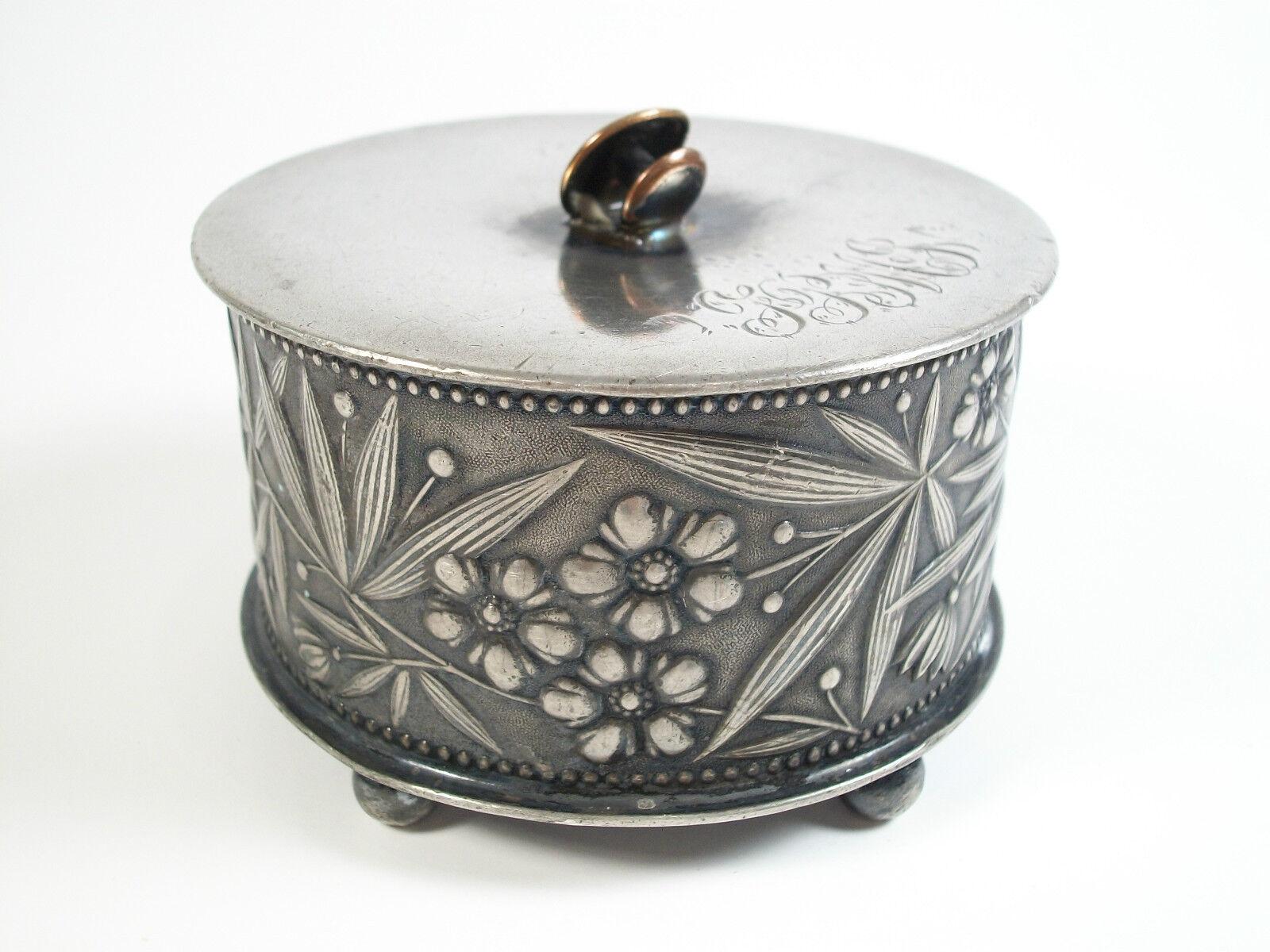 SIMPSON HALL MILLER & CO. - Arts & Crafts silver plate jewelry/cuff-links box - 'TPMJ' monogram - delicate tooling - cuff-link finial/handle - signed and marked on the base 'QUADRUPLE PLATE' - United States - late 19th century.

Excellent antique