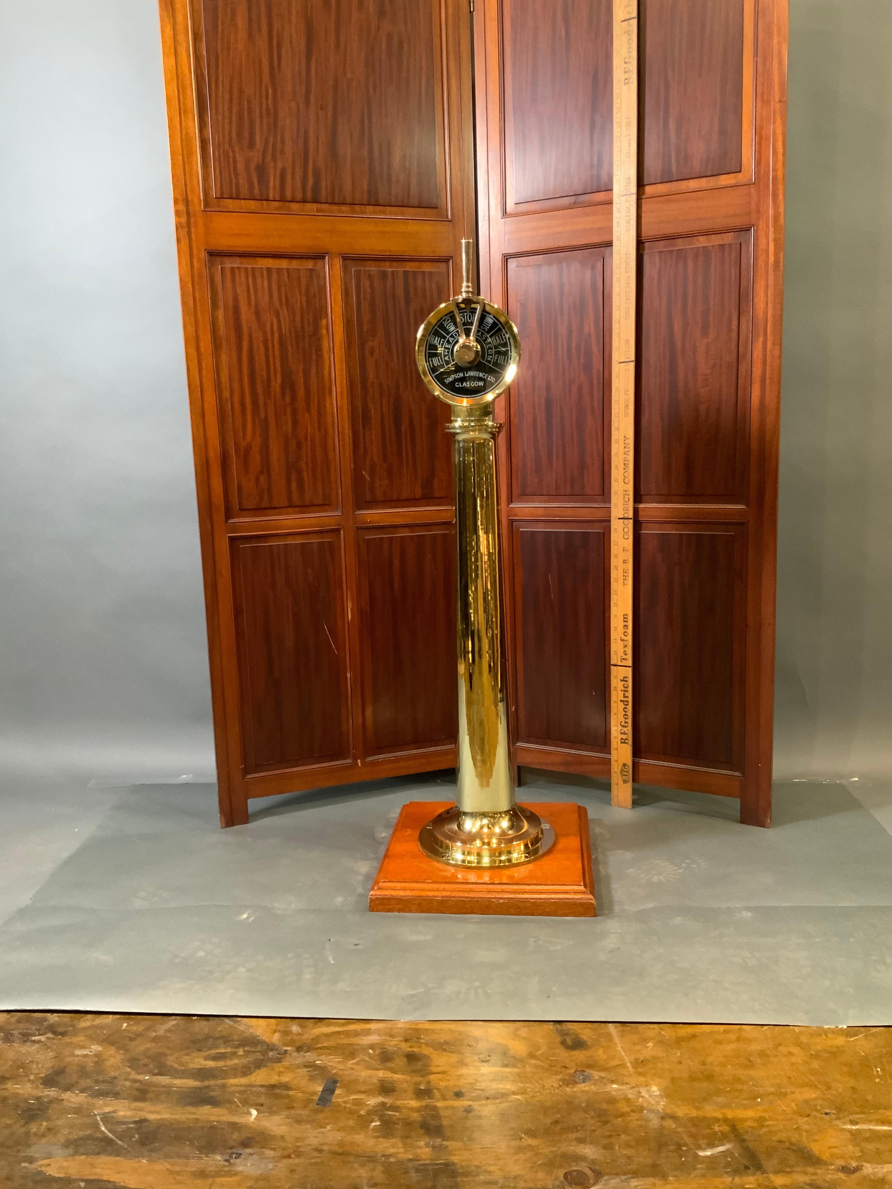 Here is a very sweet solid brass highly polished engine order telegraph by Simpson Lawrence. 43 pounds. Nice slender telegraph mounted to a wood base. Dimensions 40 tall by 7 by 5. Base is 15 by 15 square. $3995.