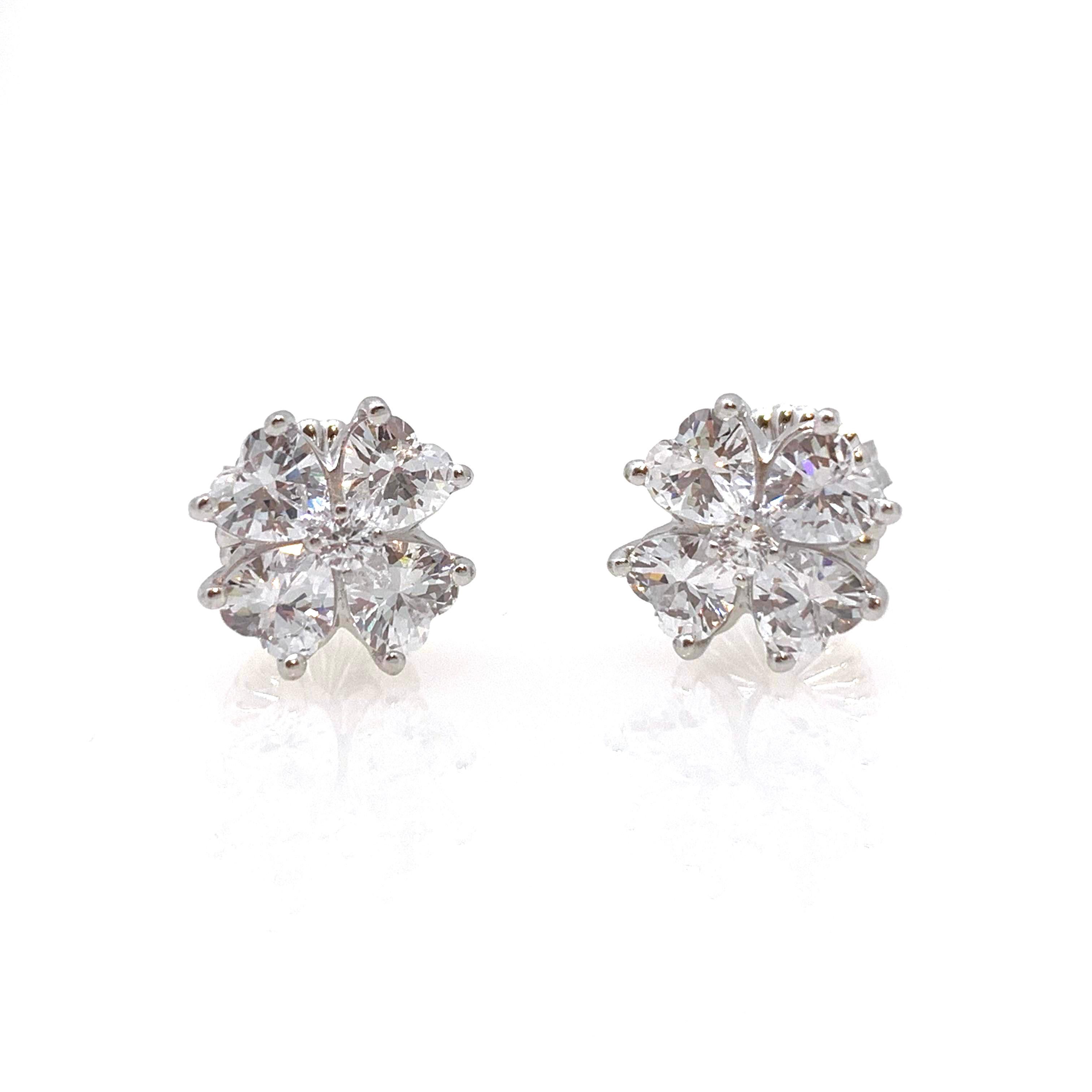 Stunning Simulated Diamond Flower Stud Sterling Silver Earrings

These classic earrings feature clustered of simulated diamond cz handset in platinum rhodium plated sterling silver. The earrings measured 1/2