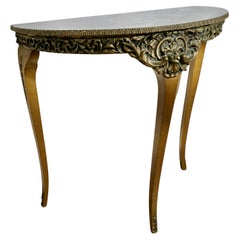 Table console sur pied en simili marbre et dorée