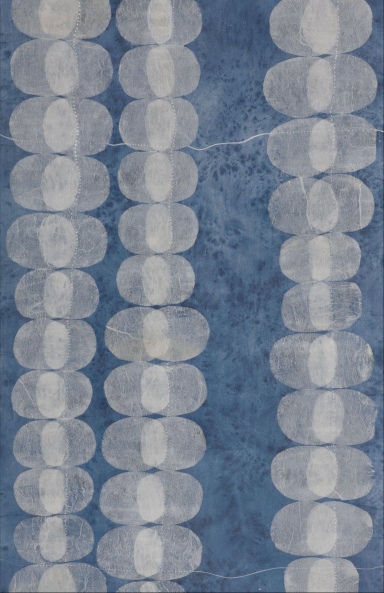 Cells, pulses, synapses. Transparencies that remind us of the infinite frailty of the universe.
Wallpaper with silver light reflections on an indigo blue background, with transparencies of overlapping tissue paper. Each process has been hand