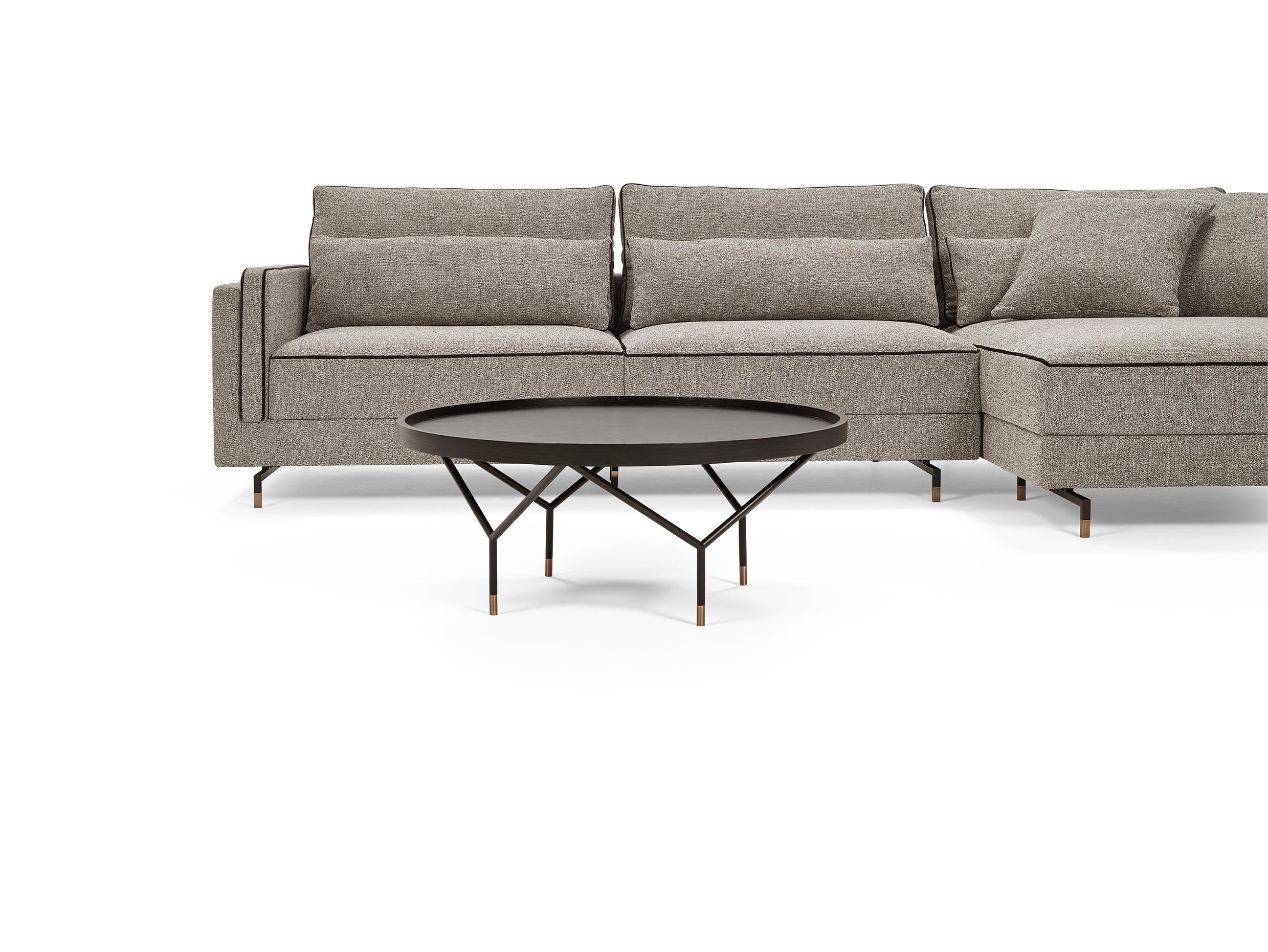 The SINATRA modular seating system is the result of a search for elegance, comfort and versatility combined with each other. The contemporary style design of the Sinatra sofa is characterized by a seamless contrast piping detail that defines its
