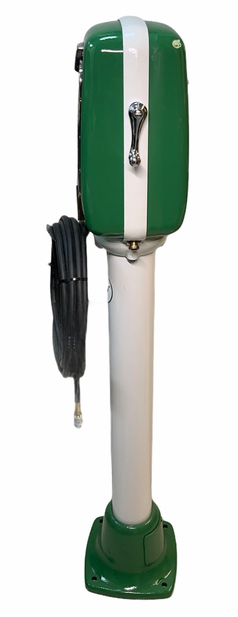 This is an Eco air meter model 98 pedestal mounted. It is painted in white & green because of the Sinclair Dino gasoline company. It meters the air. It operates by air pressure, not electricity. This model is no longer being made, but it was made by