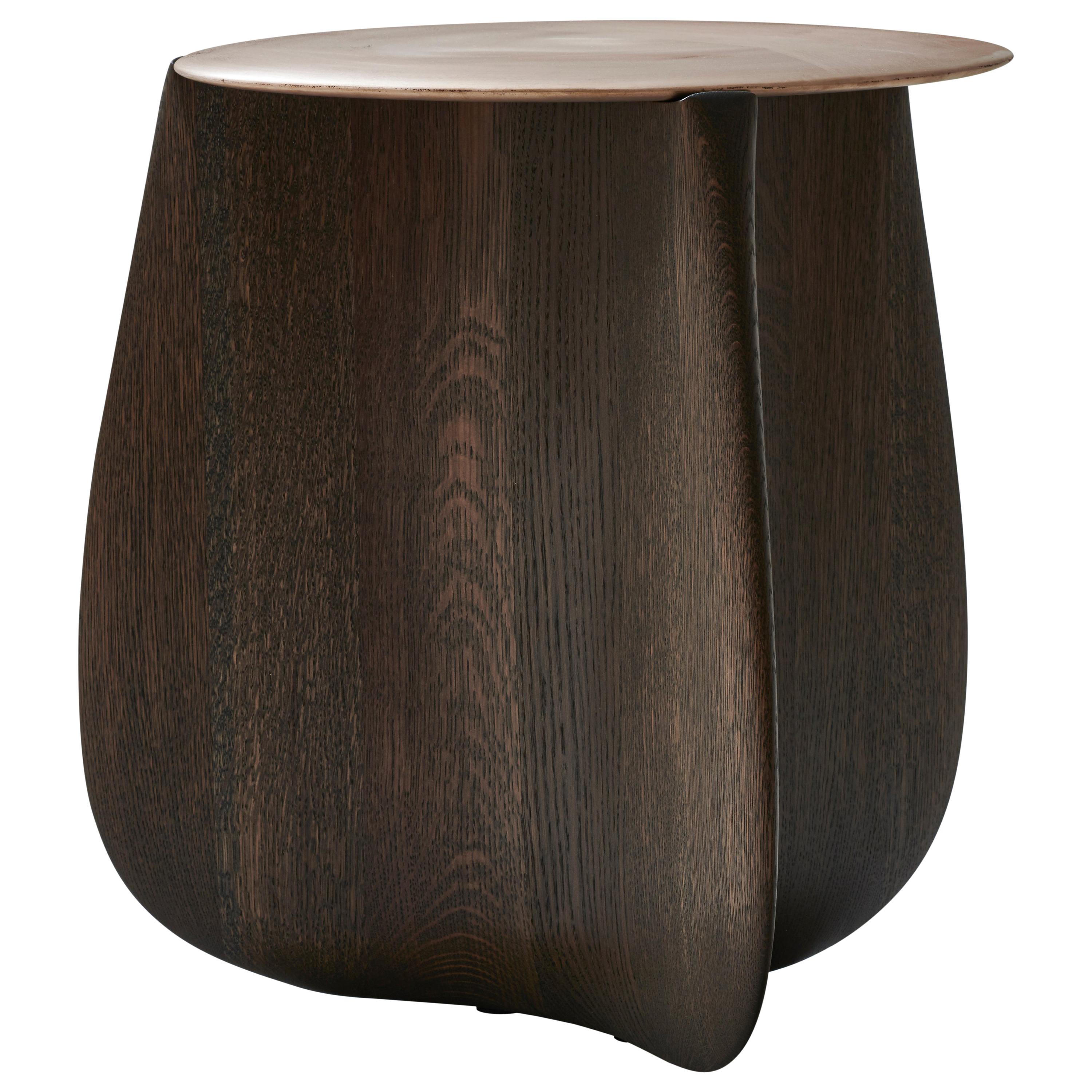 Sine by Izm Design is a 2020 Best of Year recipient from Interior Design Magazine. It features a burnished, cast bronze top perched on a sculpted, solid hardwood base.. A stunning piece that blurs the lines between art & furniture. 
Available in 2