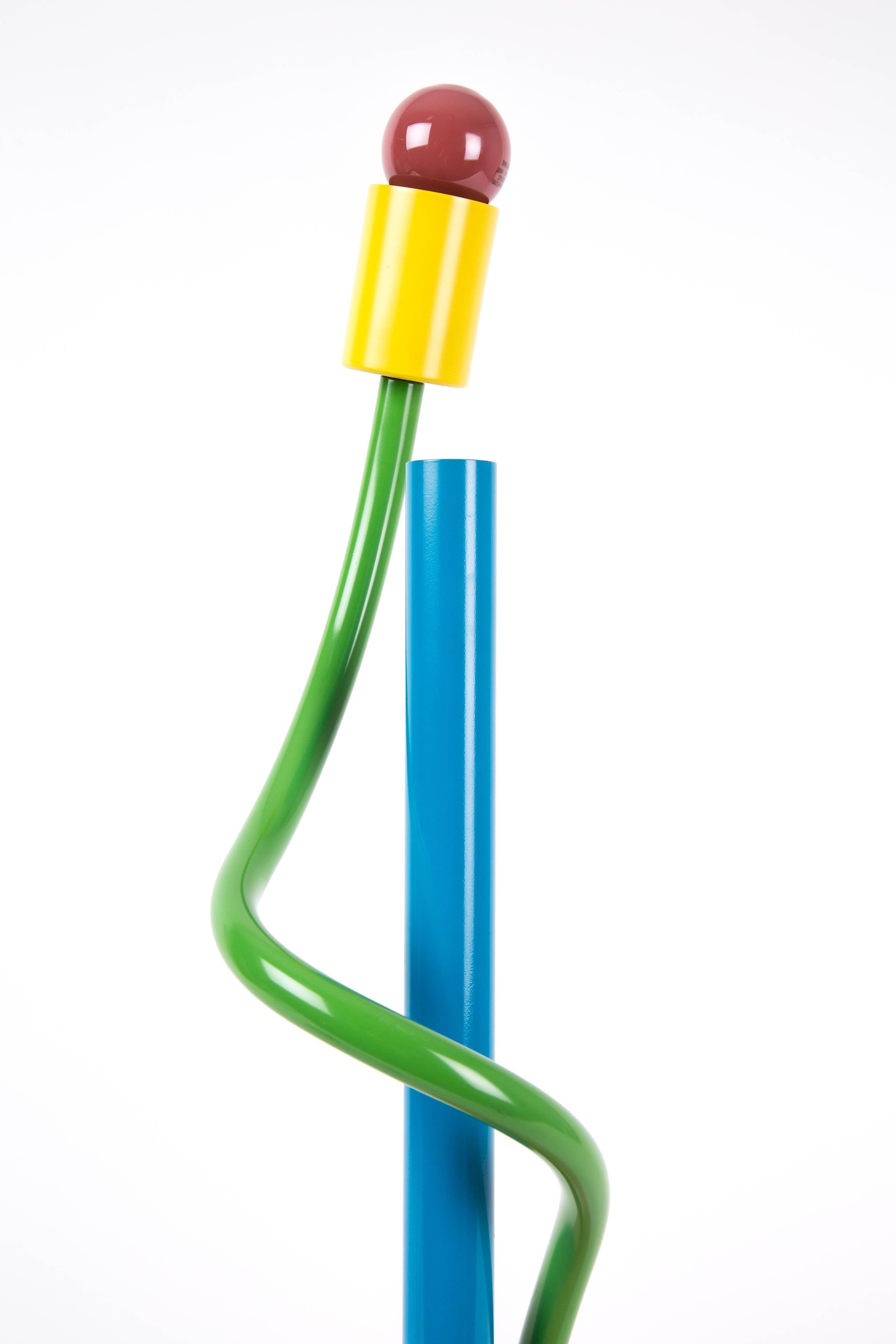 Sinerpica lamp by Michelle de Lucchi for Alchimia. De Lucchi is a member of the Memphis movement. This lamp has happy colors, blue, yellow, green and pink. Not in production yet. There are no re-editions of this lamp, thus very exclusive. Good to