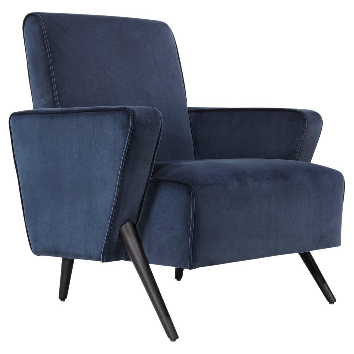 Sinfonia retro armchair upholstered in dark blue velvet by Bow and Arrow