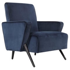 Sinfonia retro armchair upholstered in dark blue velvet by Bow and Arrow