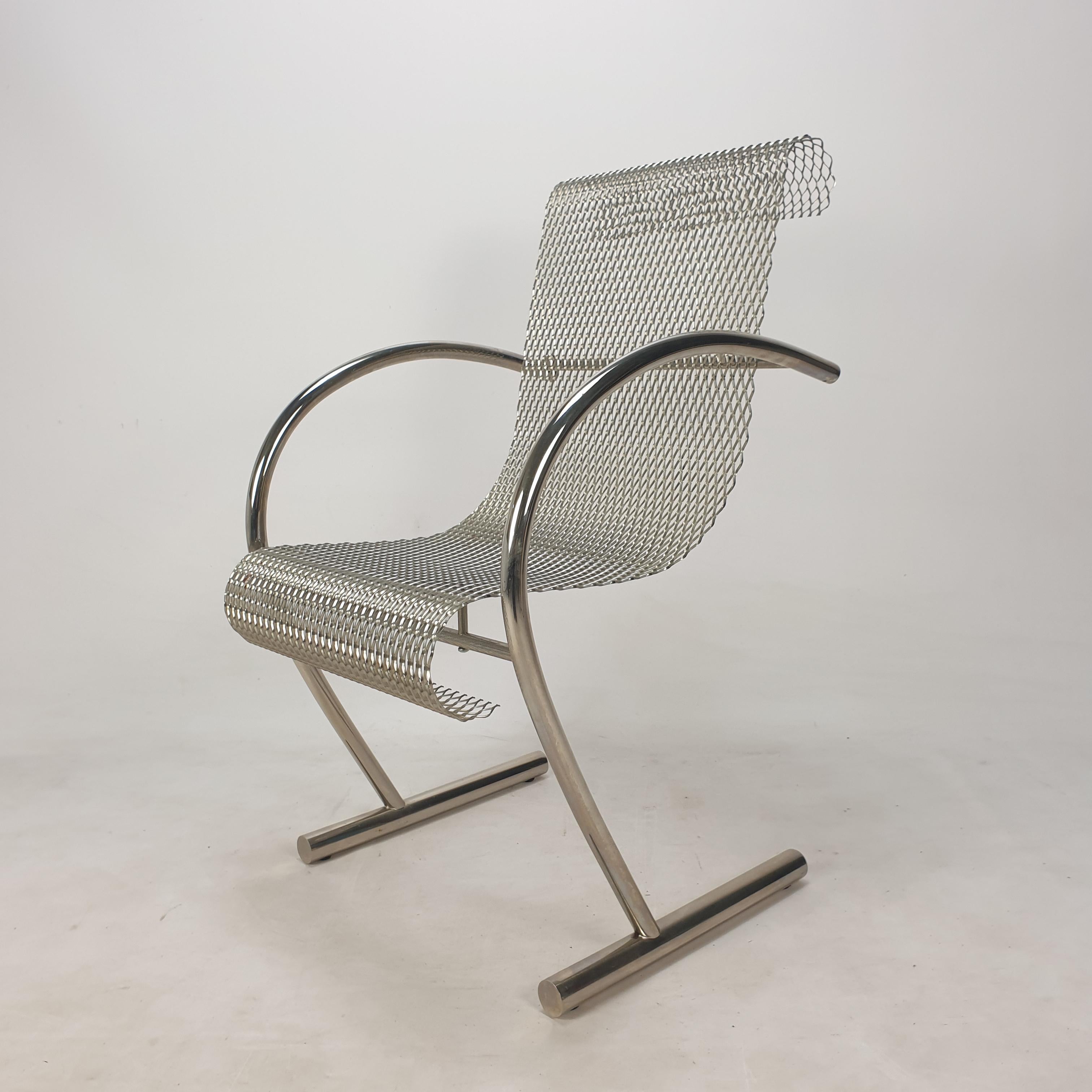 Beautiful Sing Sing Sing chair, designed by Shiro Kuramata and manufactured by XO, 1985.

The chair is crafted from tubular steel and expanded steel mesh. 
It is marked on a leg, see the picture.

Shiro Kuramata (1931-1991) created a fluid