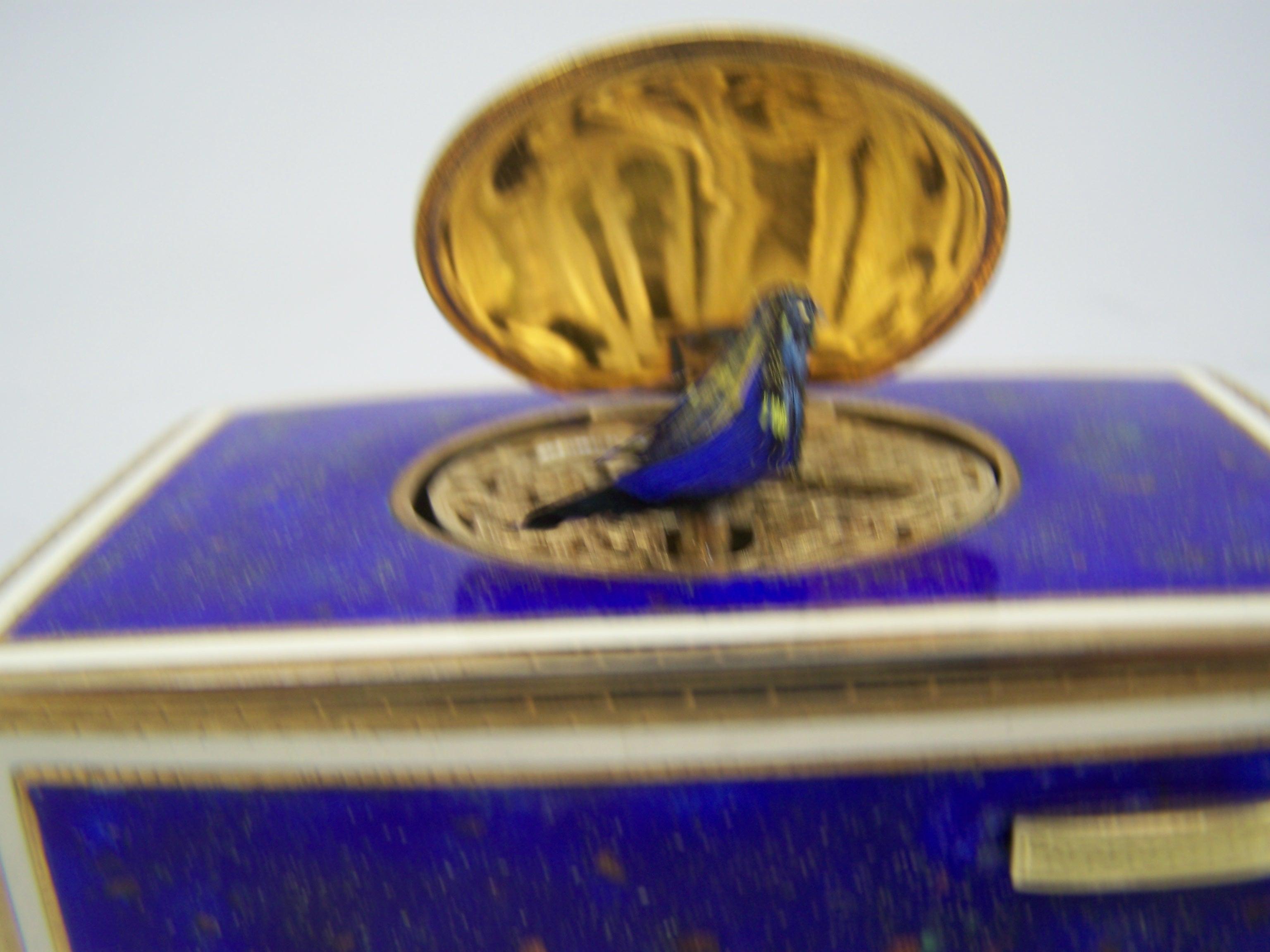 20th Century Singing bird box by K Griesbaum in guilded case and blue-goldflaked enamel