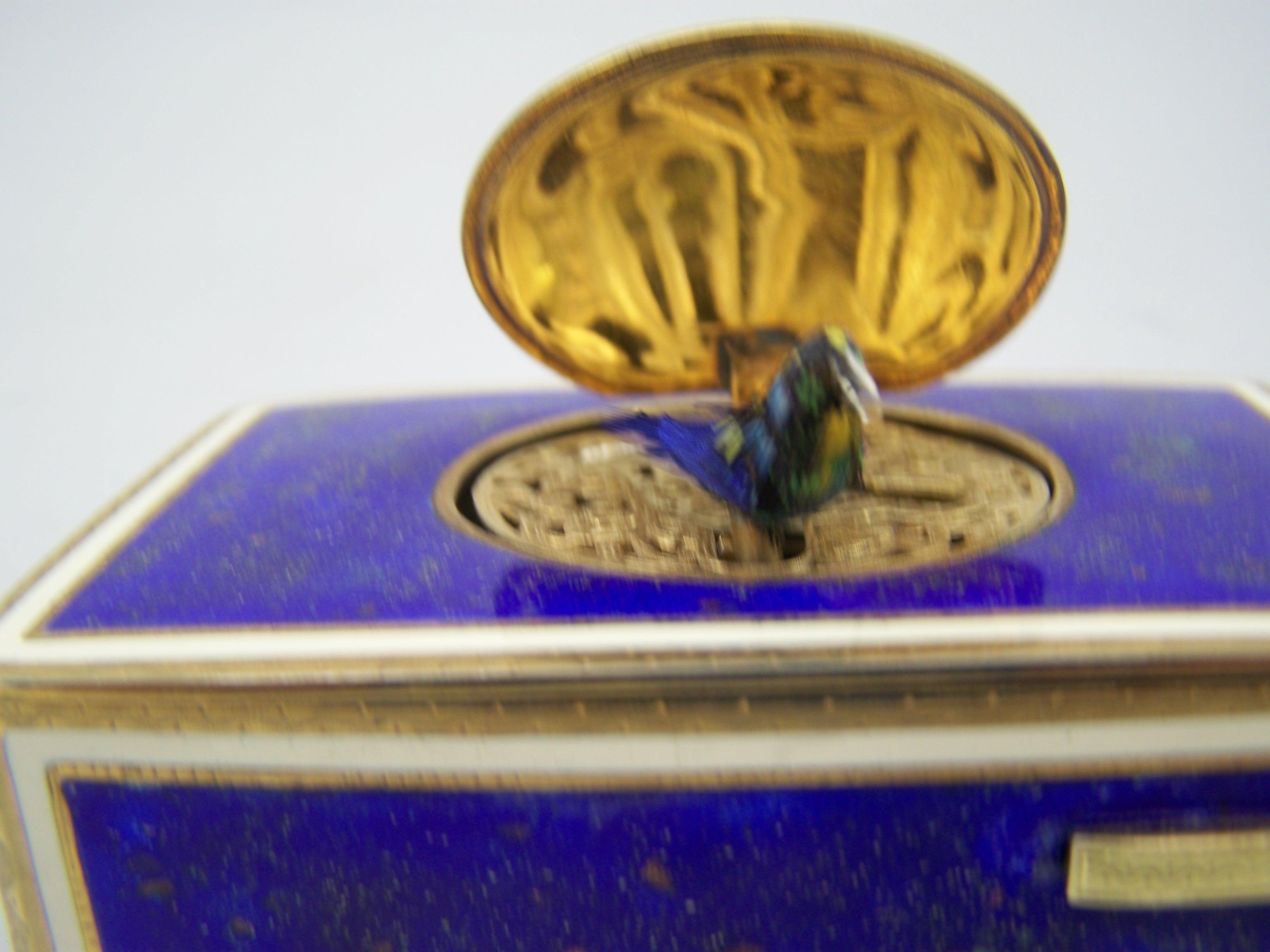 Enamel Singing bird box by K Griesbaum in guilded case and blue-goldflaked enamel