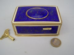 Singing bird box by K Griesbaum in guilded case and blue-goldflaked enamel