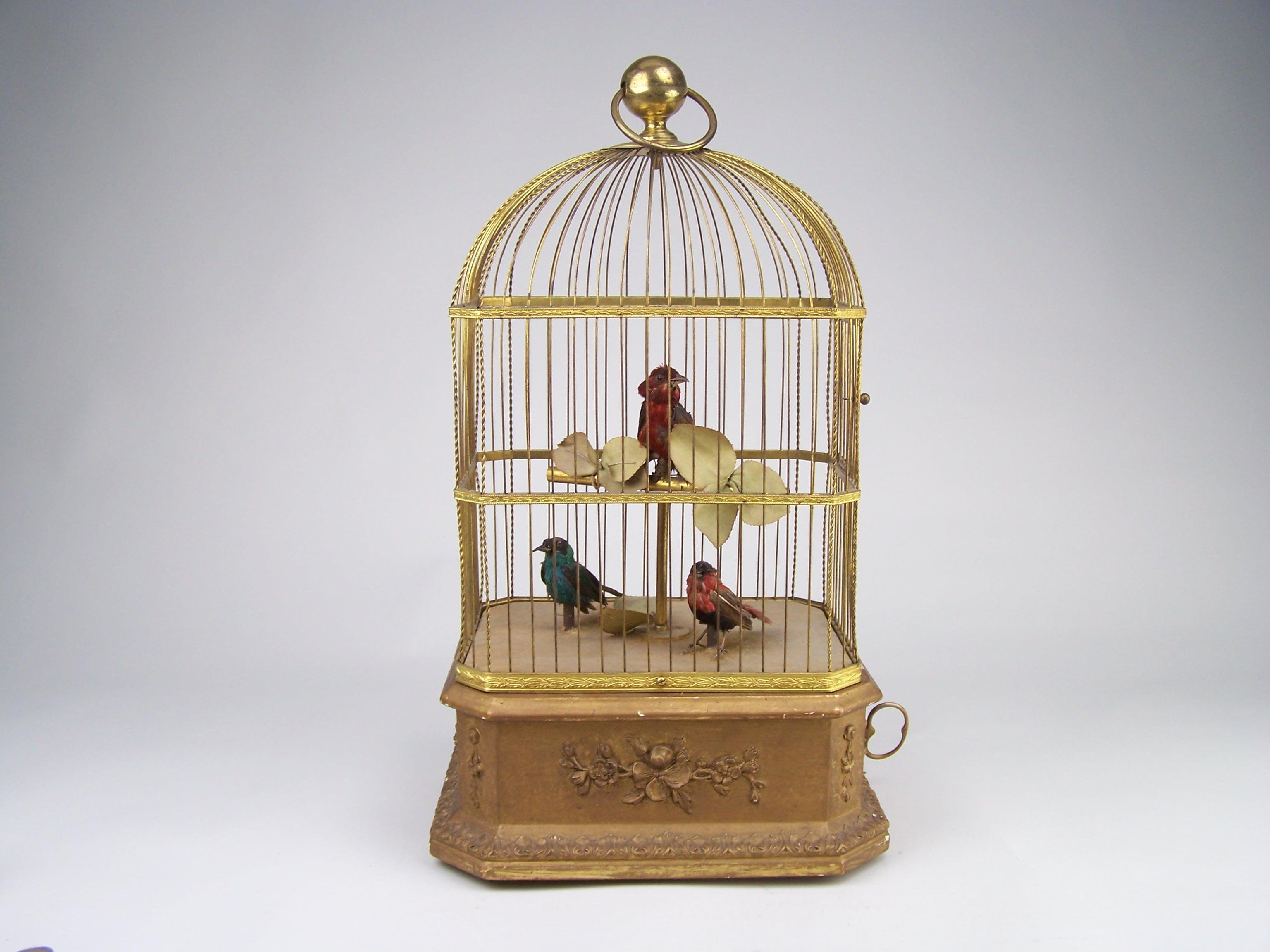 Rare and very decorative singing bird automaton.

Made in de 4th quarter of the 19th century by Bontems in Paris (France).

This singing bird cage has a wooden gilded base to conseal the mechanism. In the cage there are 3 original birds in a lovely