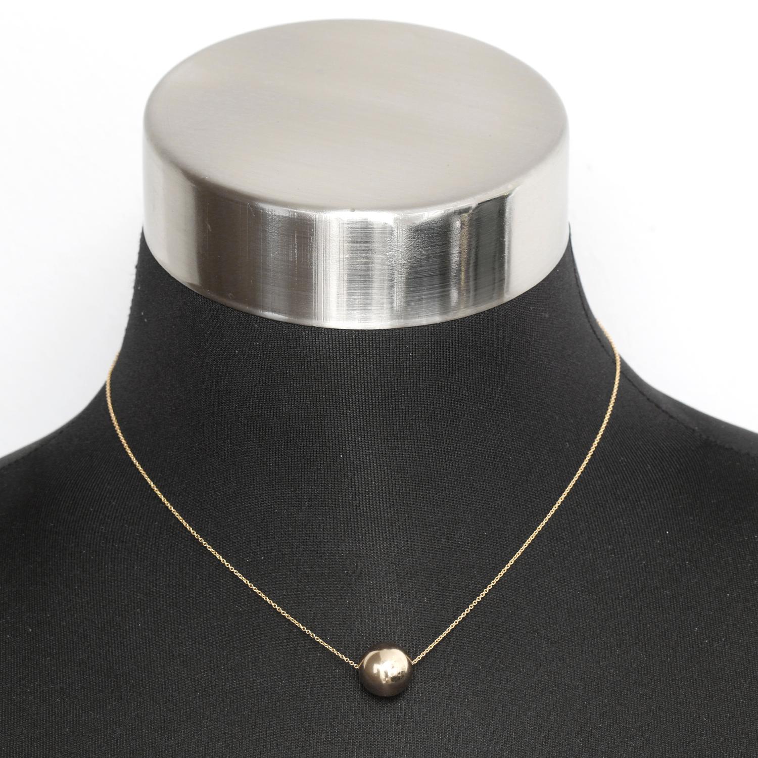 Single 14K Yellow Gold Ball Necklace  - 14K Yellow Gold 12 MM ball on a 14K Yellow gold chain. Total length 16 inch chain. Total weight 1.6 grams.