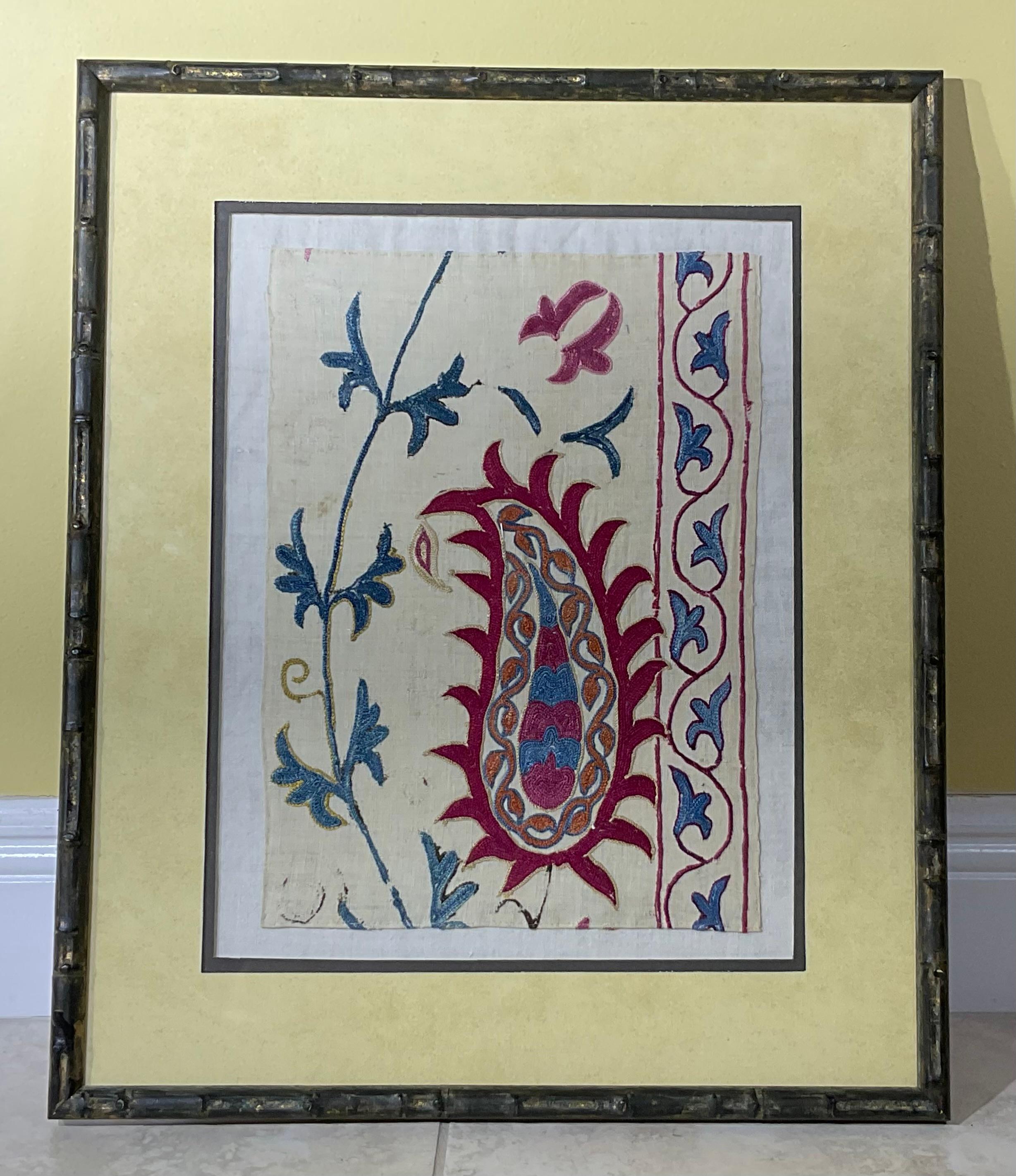 Exceptional antique hand embroidery Suzani textile, beautiful purple and indigo colors , fine silk embroidery  on cotton background, all professionally hand sewn to linen backing , quality bamboo style solid wood frame , ready to hang .
One of a