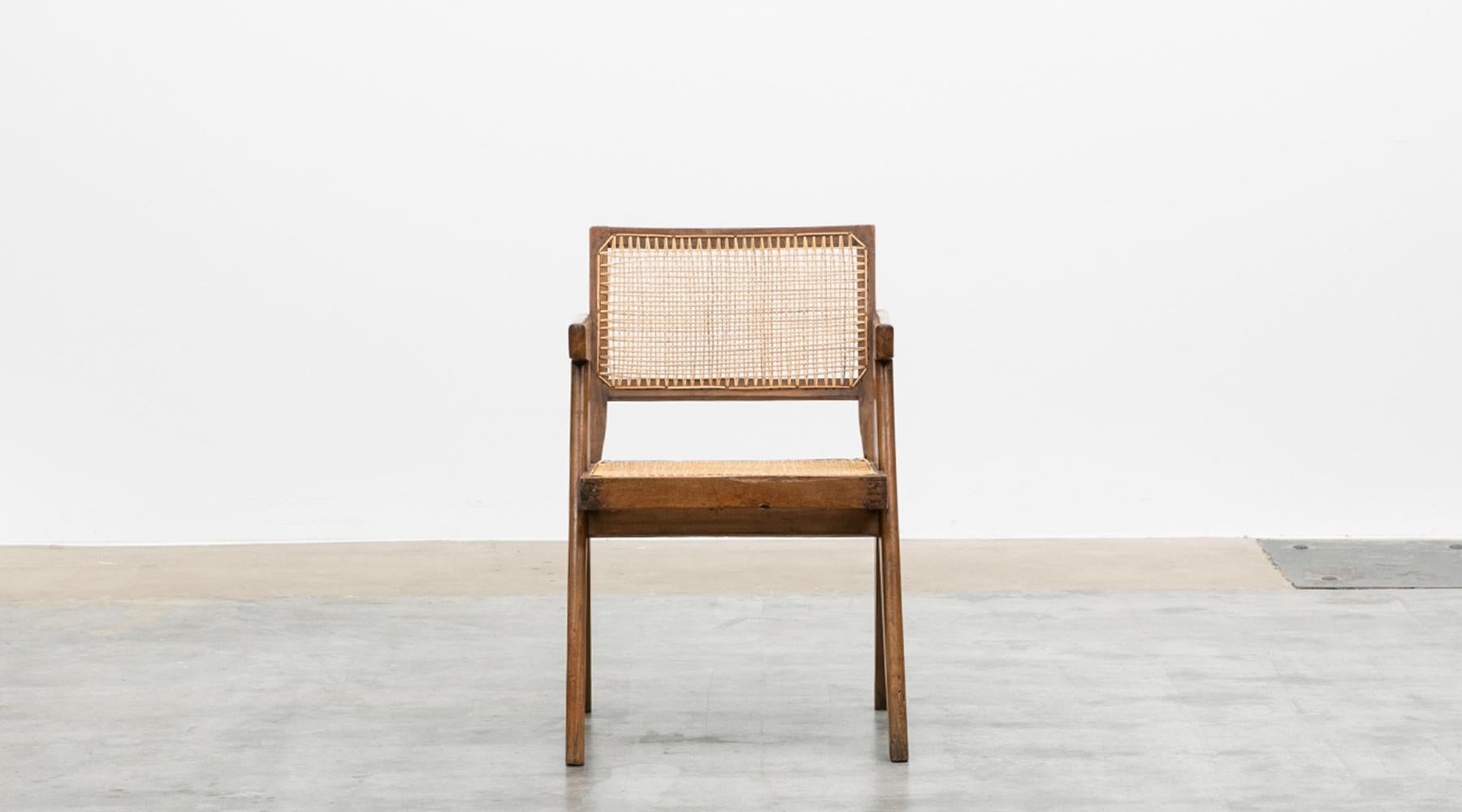 Rare chair by Pierre Jeanneret in teak and cane, Chandigarh, India, 1955.

Single original Chair designed by Pierre Jeanneret in teak with woven cane on the seat and curved backrest appears in beautiful patina. The chair is shorter than the lounge