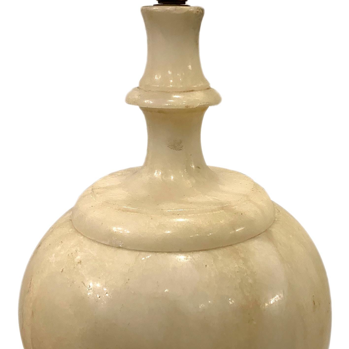 Single circa 1920s Italian alabaster table lamp with interior and exterior lights.

Measurements:
Height of body 23