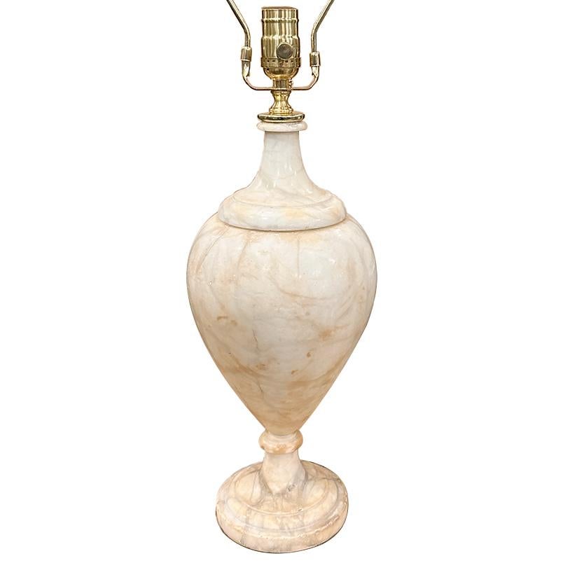 A circa 1930's Italian urn shaped single alabaster with round foot and Original patina.

Measurements:
Height of body: 16