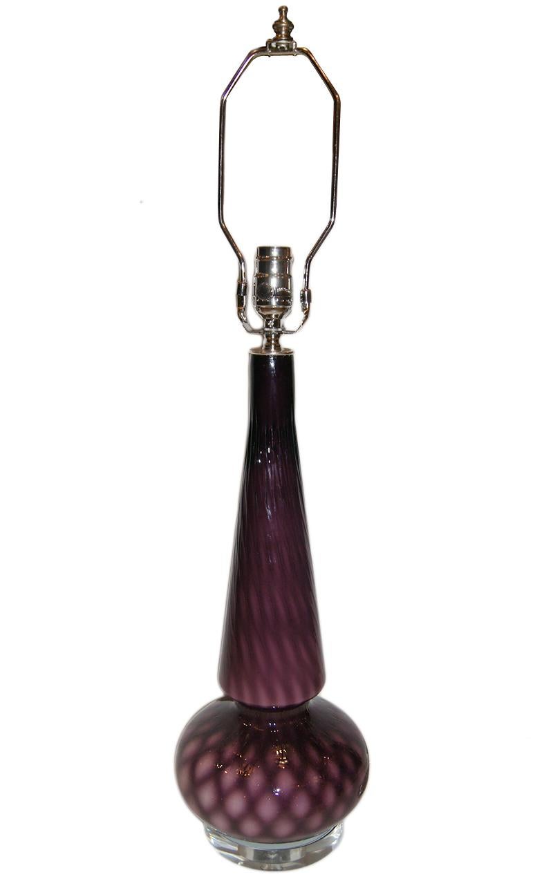 A Amethystt blown glass lamp with clear base, circa 1940s.
Measurements:
Height of body: 19.5