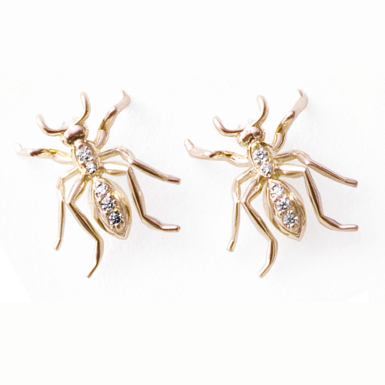 crafted from luxurious 14k yellow gold and featuring 10 round brilliant-cut diamonds pave set to perfection. These earrings are anatomically perfect and capture the light in a way that is sure to catch the eye of anyone in their presence. With their