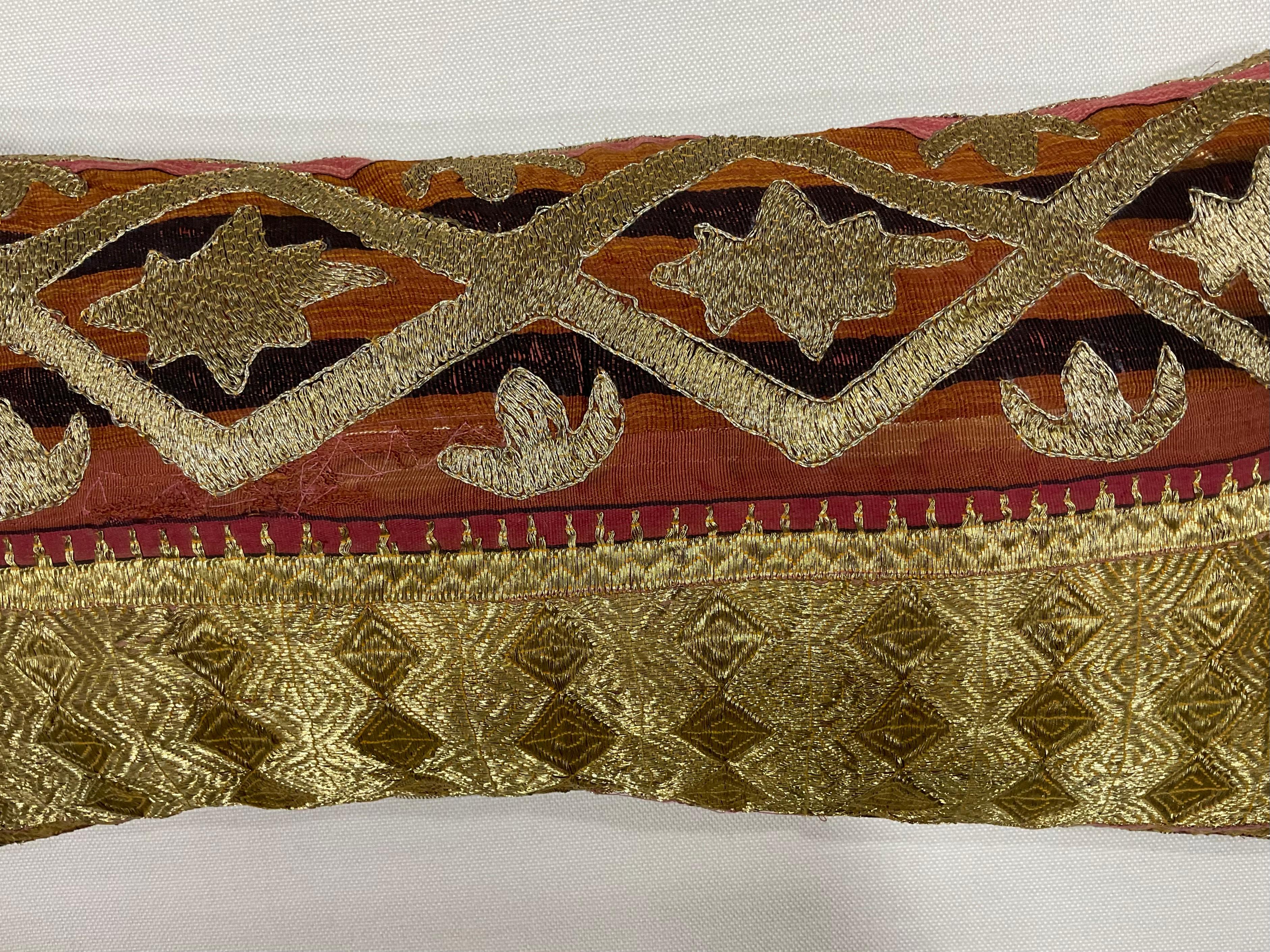 Exceptional pillow made of gold metallic thread embroidery on cotton foundation with beautiful artistic geometric motifs. Fine cotton backing. Salvaged from larger antique tribal textile.
Had some professional repair see photo.