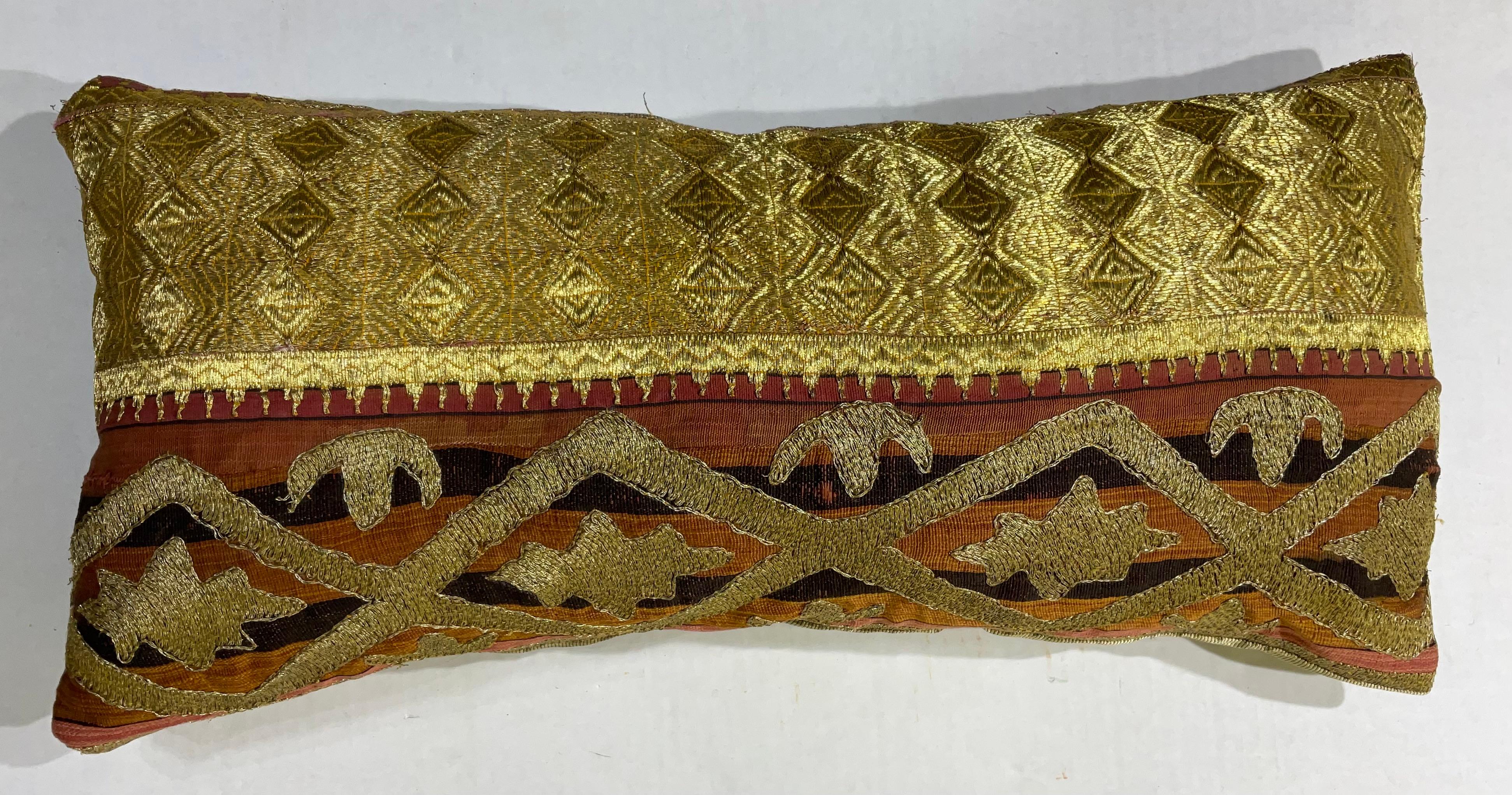 Exceptional pillow made of gold metallic thread embroidery on cotton foundation with beautiful artistic geometric motifs. Fine cotton backing. Salvaged from larger antique tribal textile.
Had some professional repair see photo.