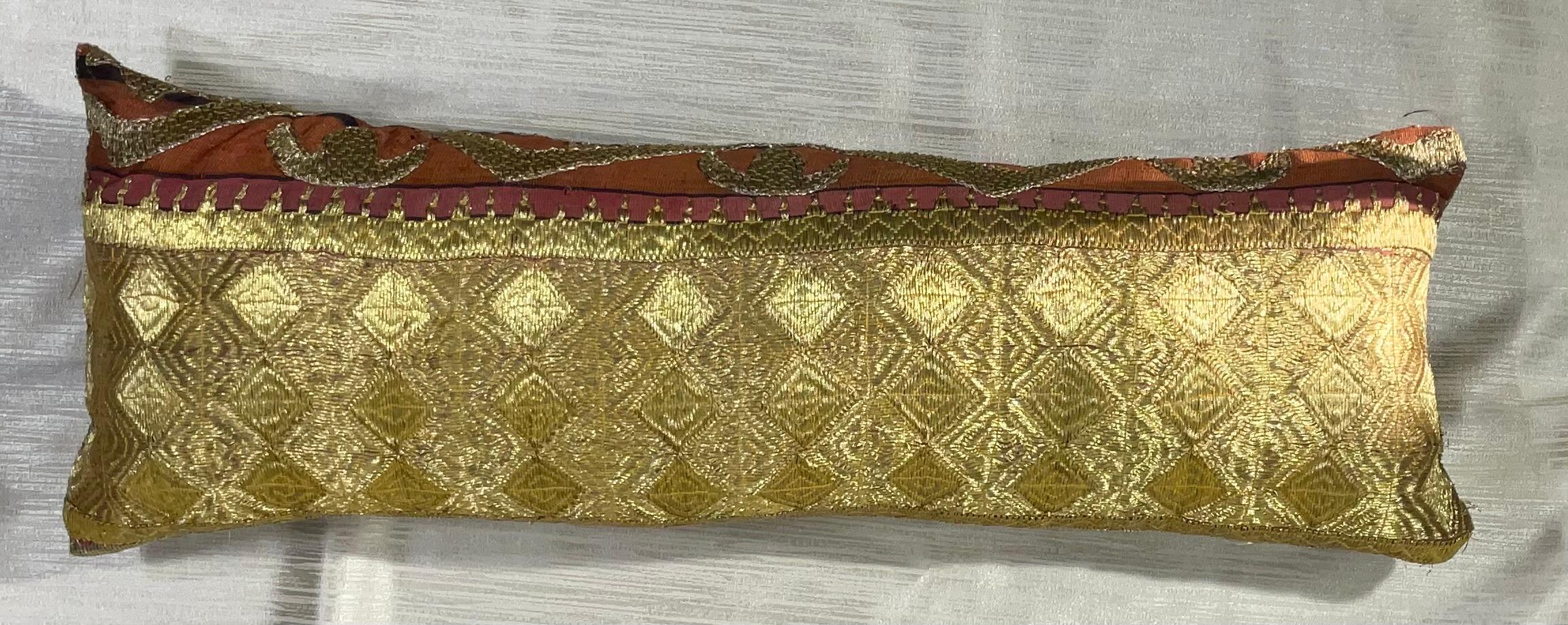 Exceptional pillow made of gold metallic thread embroidery on cotton foundation with beautiful artistic geometric motifs. Fine cotton backing. Salvaged from larger antique tribal textile.
