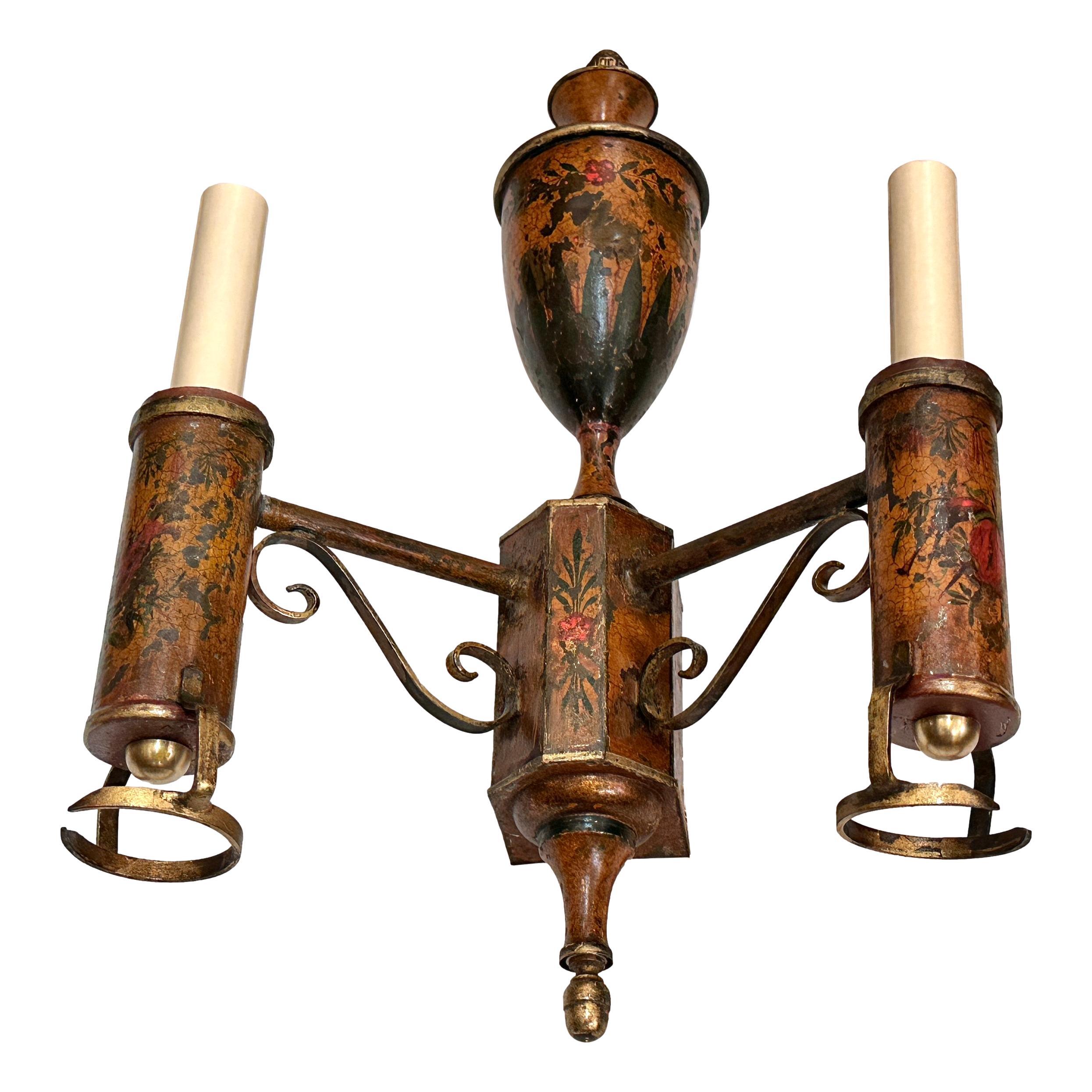 A late 19th Century French painted tole sconce with foliage decoration.

Measurements:
Height: 17
