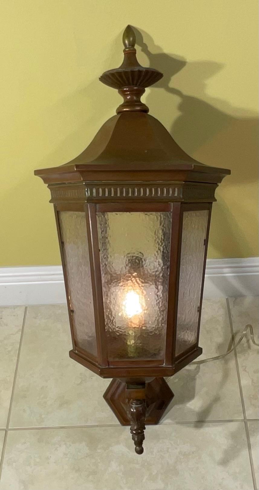 Single wall lantern artistically  handcrafted from solid copper and have one 60/watt light ,exceptional ,has the original hammer glass ,suitable for wet location. Very nice original copper patina, special quality light and I have only this