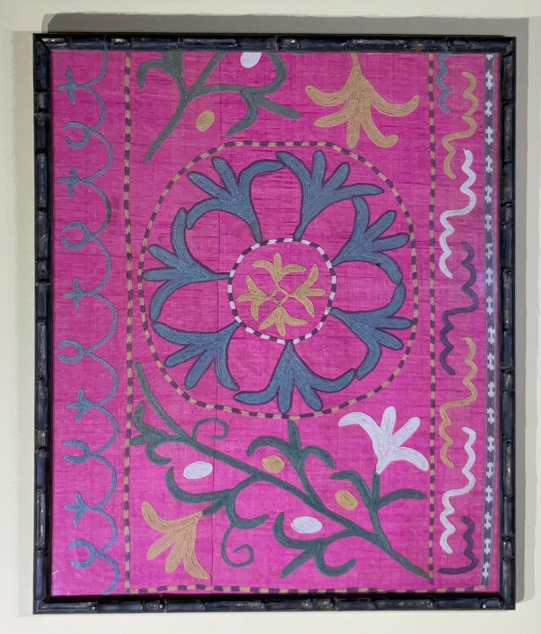 Exceptional wall hanging made of silk hand embroidery antique Suzani beautiful pink color background with silk embroidery of floral and vine motif , professionally mounted on quality solid wood bamboo style frame. 
backing sewn together by hand,