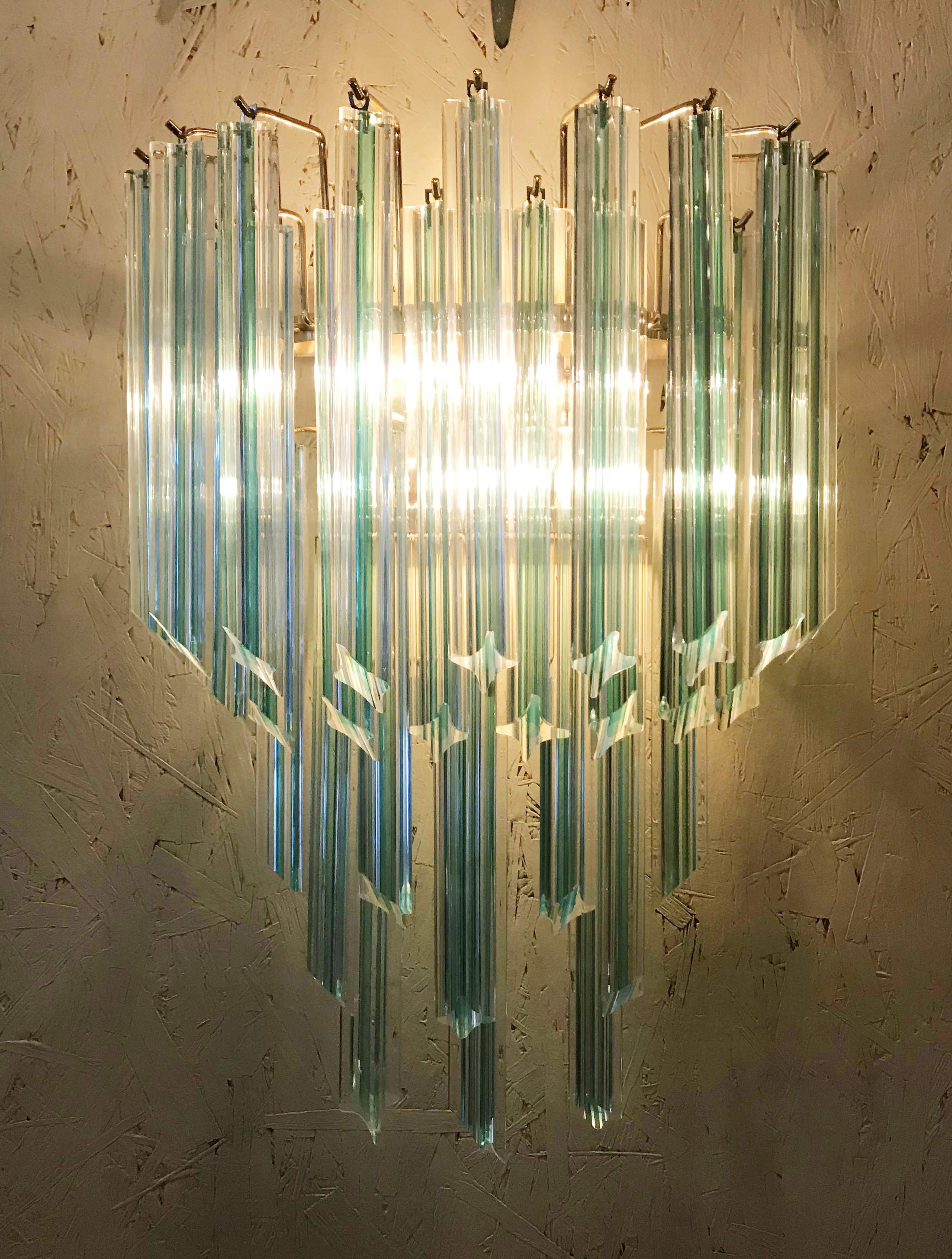 Vintage Italian wall light with hand blown aquamarine Murano glass crystals cut into four points in Quadriedri technique, mounted on brass back plates / Designed by Venini, circa 1970s / Made in Italy
2 lights / E12 or E14 type / max 40W