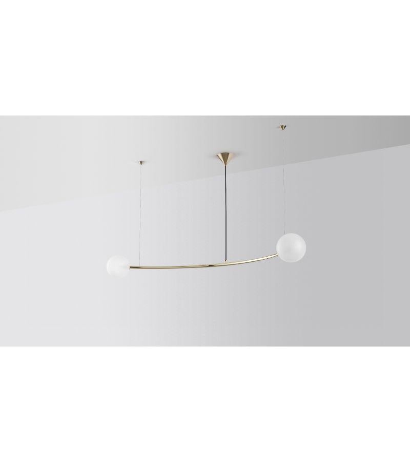 Single arc oddments chandelier by Volker Haug
Dimensions: Diameter 110 x H 40 cm 
Material: Brass. 
Finish: Polished, Aged, Brushed, Bronzed, Blackened, or Plated
Cord: Black Fabric
Light: : G9 LED (110V - 240V) or G4 LED (12V)
Glass Bulb: