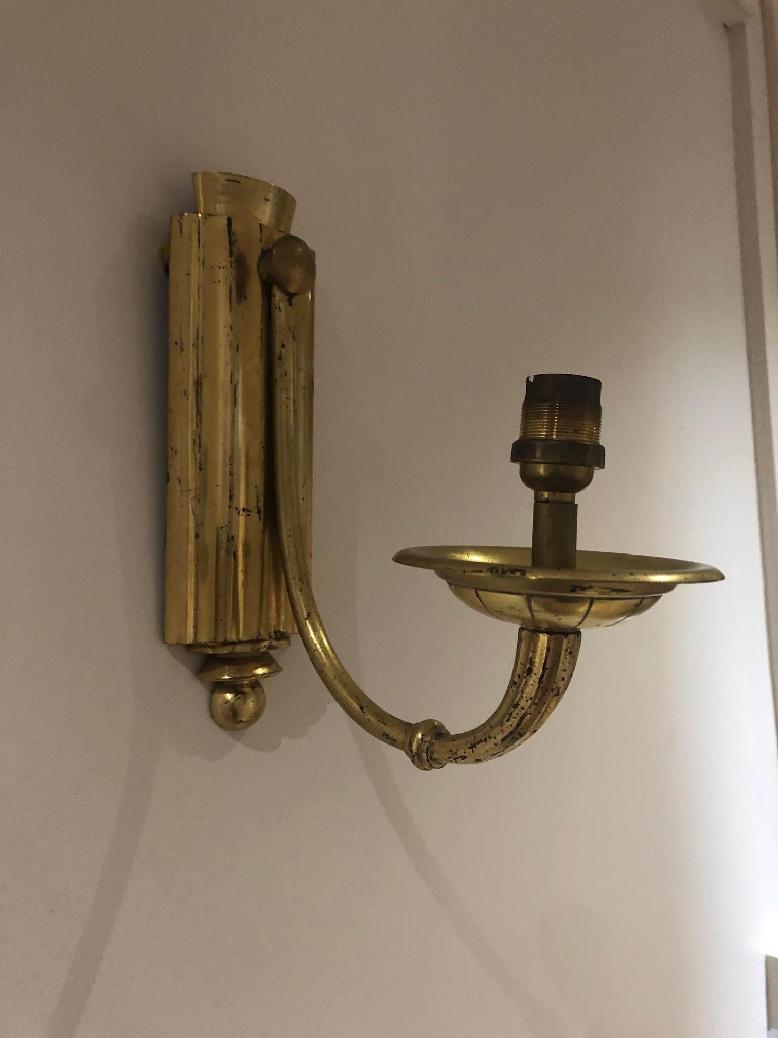 Brass wall lights in their original condition form the 1930s , art deco period
  