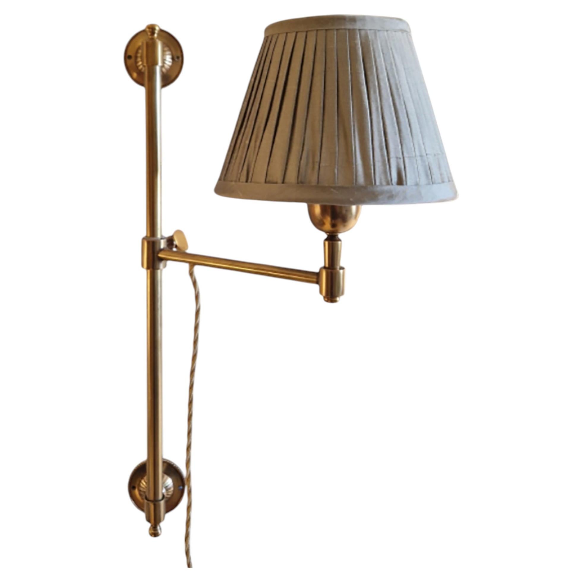 Single arm swing arm Library Light in Antique Brass with Silk pleated shade