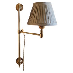 Single arm swing arm Library Light in Antique Brass with Silk pleated shade