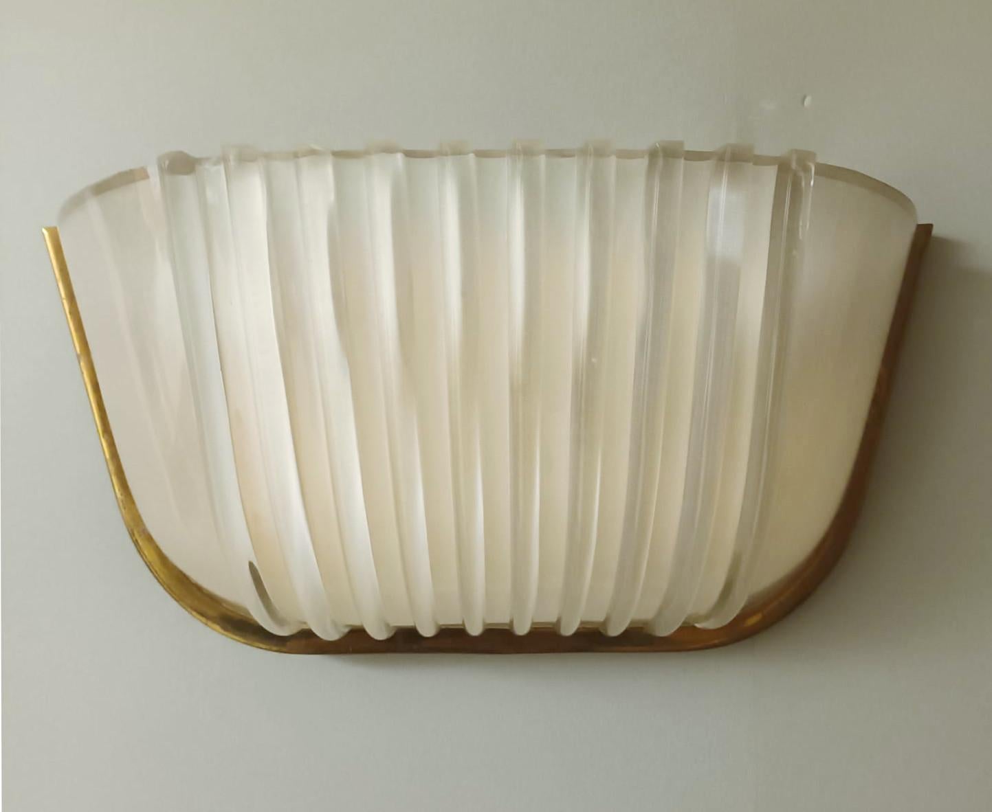 Vintage French wall light with Art Deco ribbed frosted glass / made in France circa 1930s
2 lights / E12 or E14 type / max 40W each
Measures: Height 6 inches / Width 13 inches / Depth 5 inches
1 available in stock in Italy
Order reference #: