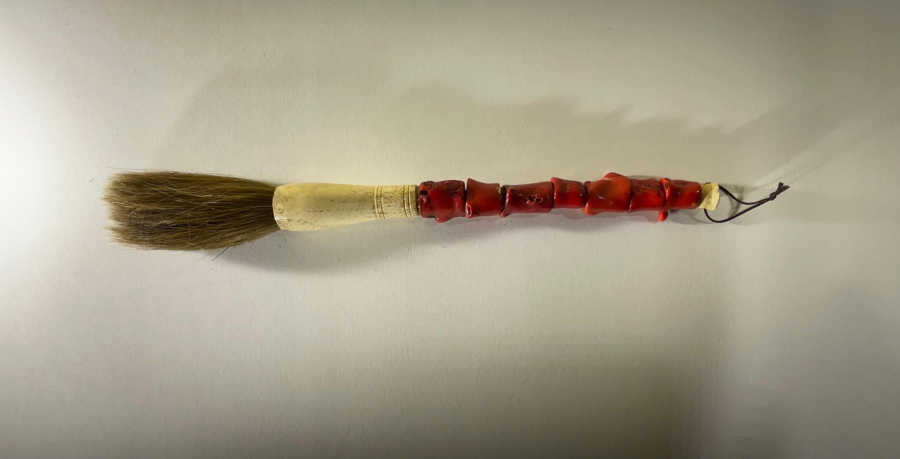 Beautiful single hand made calligraphy brush with exceptional asian red color coral beads ,bone , ferrule and horse hair. 
 Slight variation in each bead due to characteristics of genuine stone and bone.


