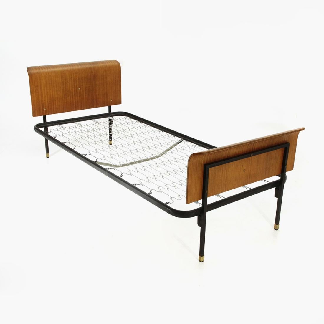 Bed manufactured in Italy, produced in the 1950s.
Structure in black painted metal.
Headboard and footboard in curved plywood.
Brass feet and screws.
Good general condition, some signs, lack of paint and veneer due to normal use over time, a